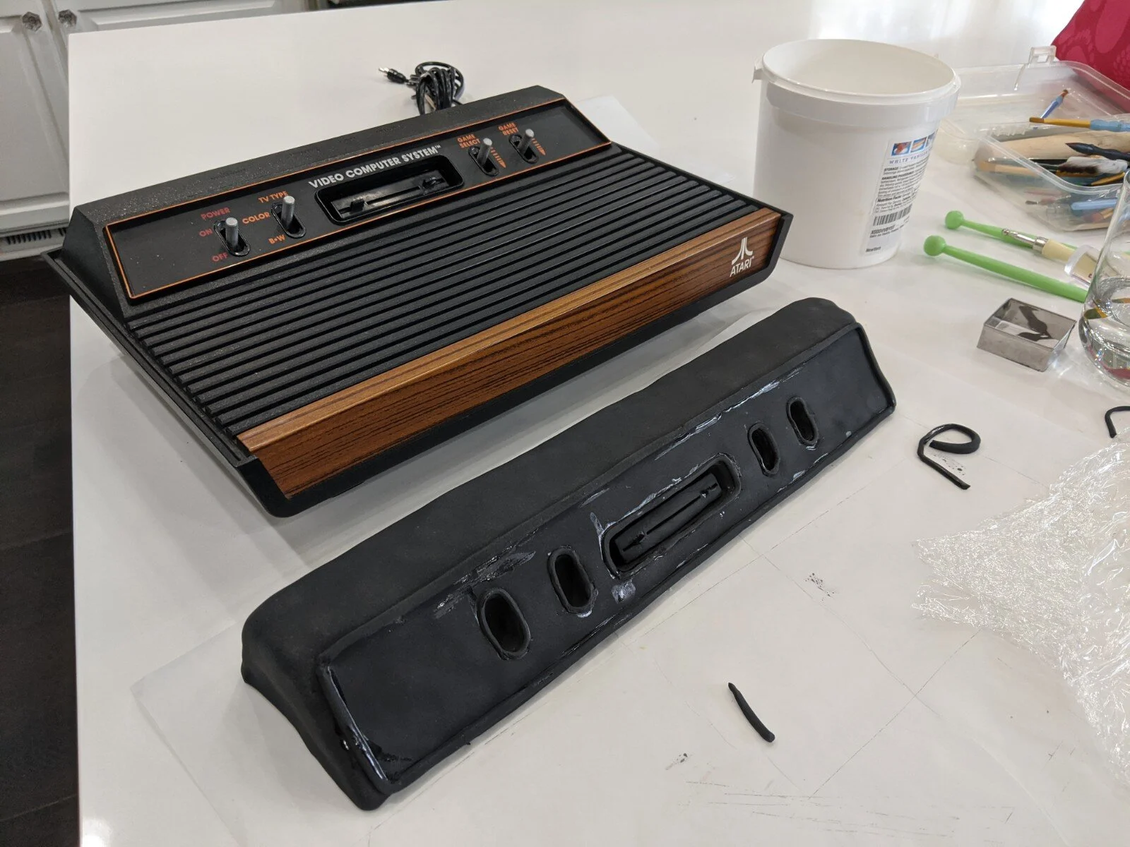 I then cut out very small strips and put the outlines around the cavities, as well as made the cartridge slot.