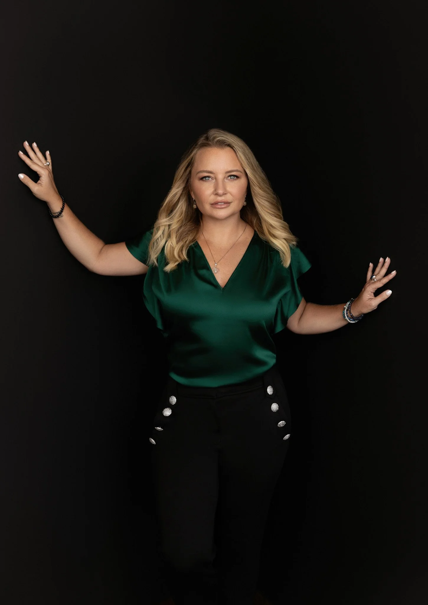 Nashville branding portrait of a woman in an emerald dress with a bold color pop by Judith Hill Photography