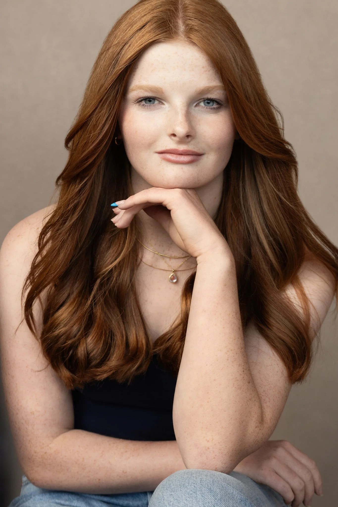 Young woman with long red hair and freckles, Nashville natural-light portrait by Judith Hill