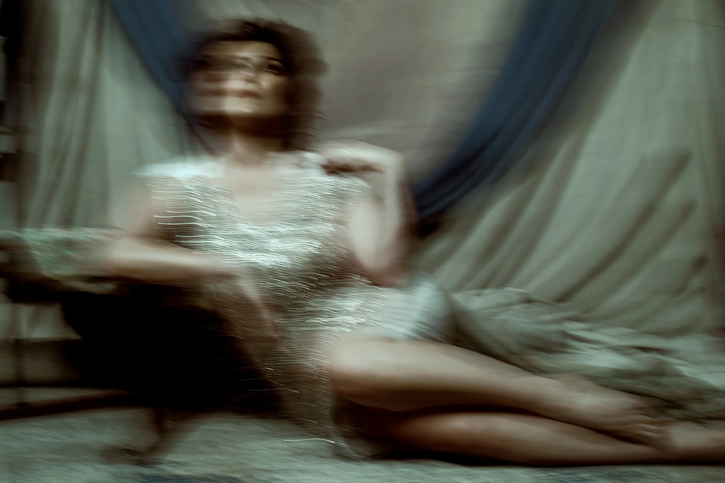 glamor photo of a woman in sequins and has motion blur. Judith Hill portrait.