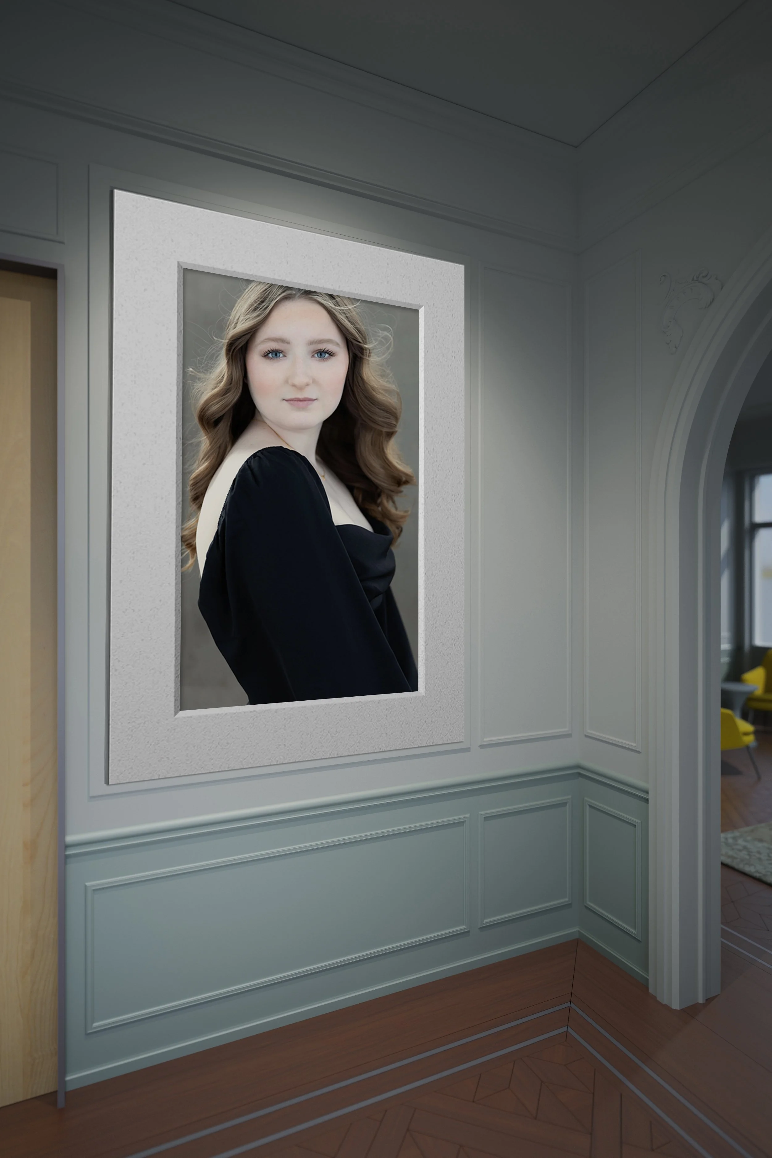 A hallway interior mockup featuring a large portrait print. The portrait shows a young woman with wavy brown hair and blue eyes looking forward, dressed in a black off-the-shoulder gown.