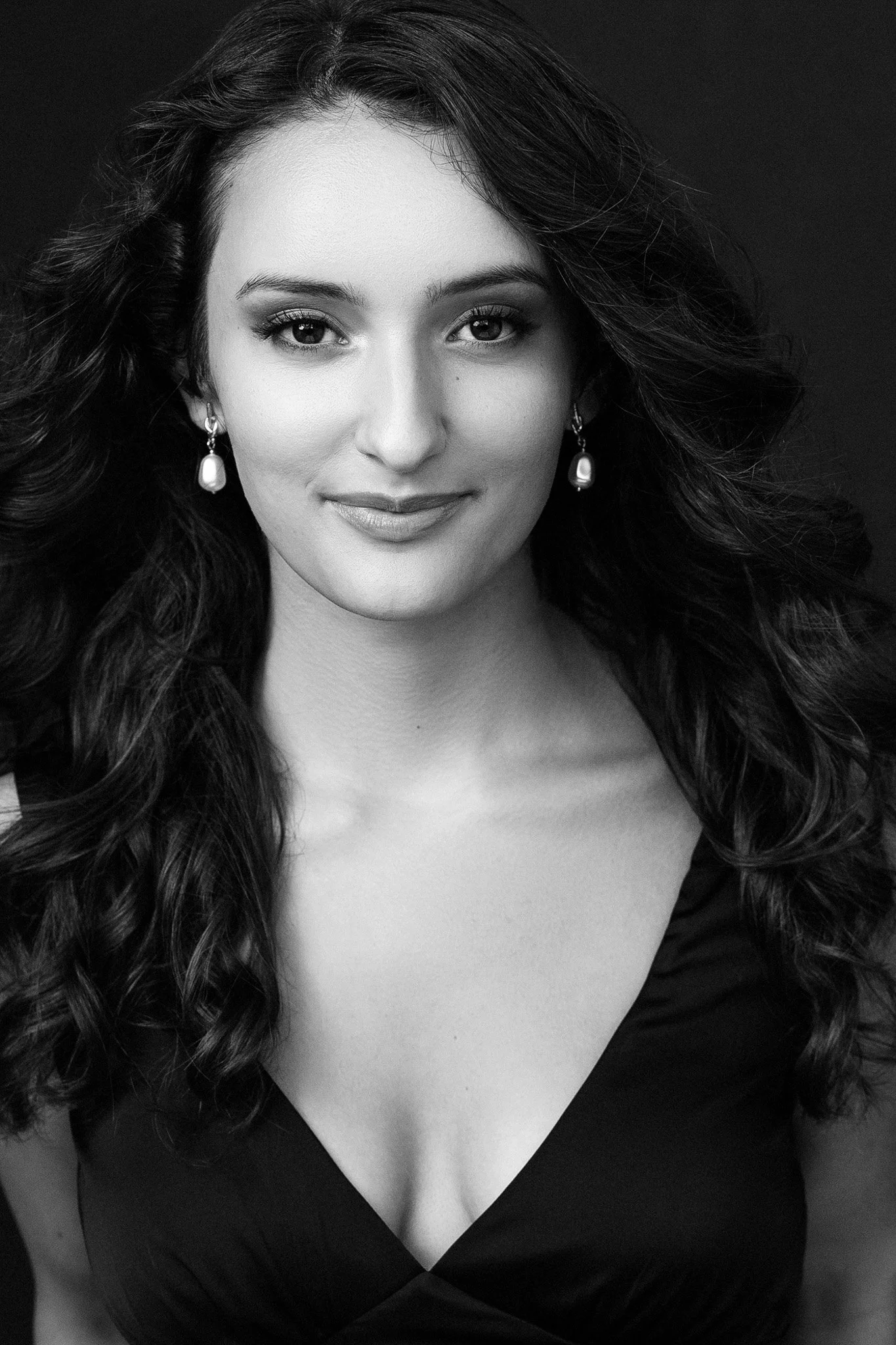 Black-and-white portrait of a young woman with pearl earrings, Nashville portrait by Judith Hill