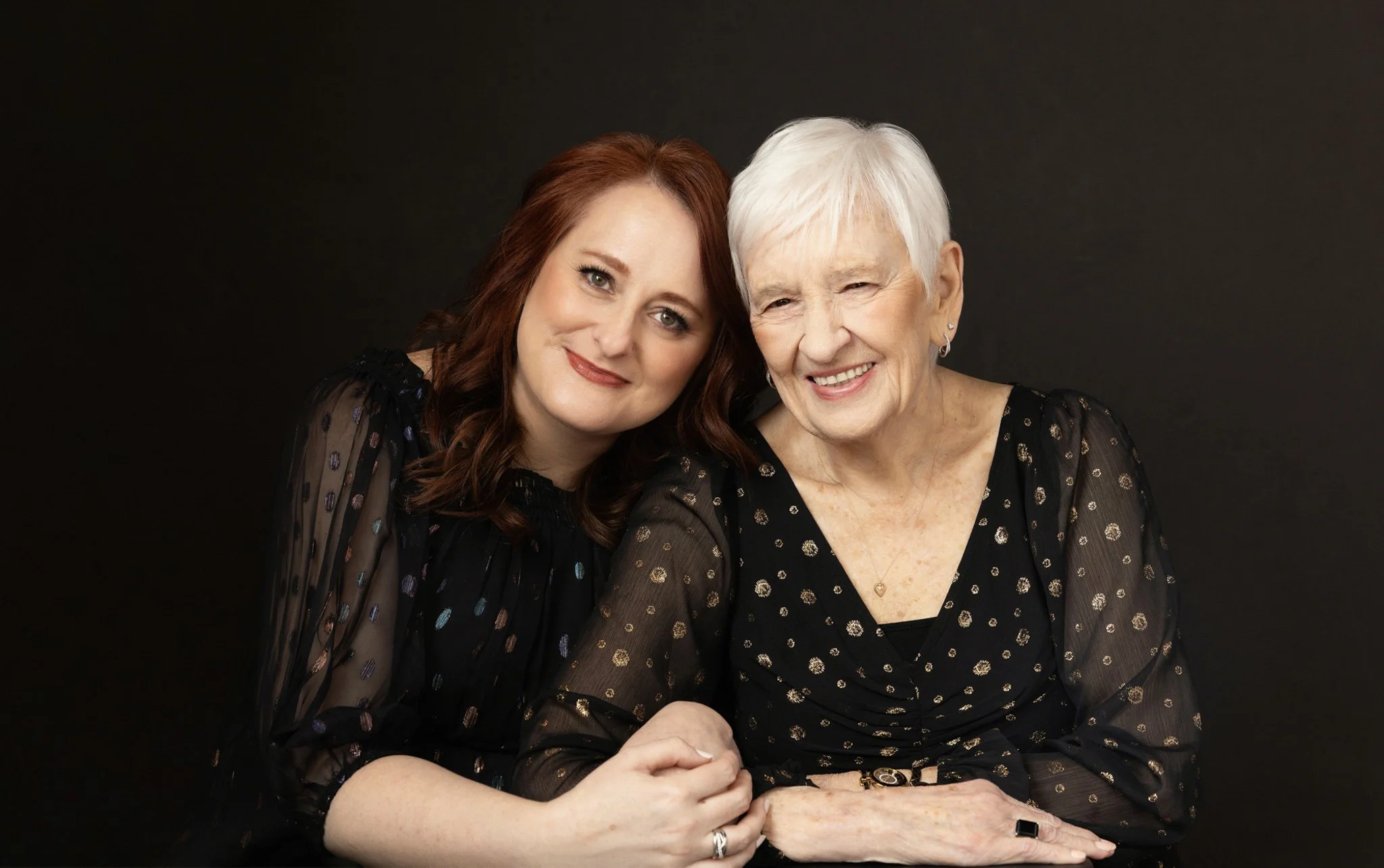 Mother and adult daughter laughing together in black, Nashville generations portrait by Judith Hill