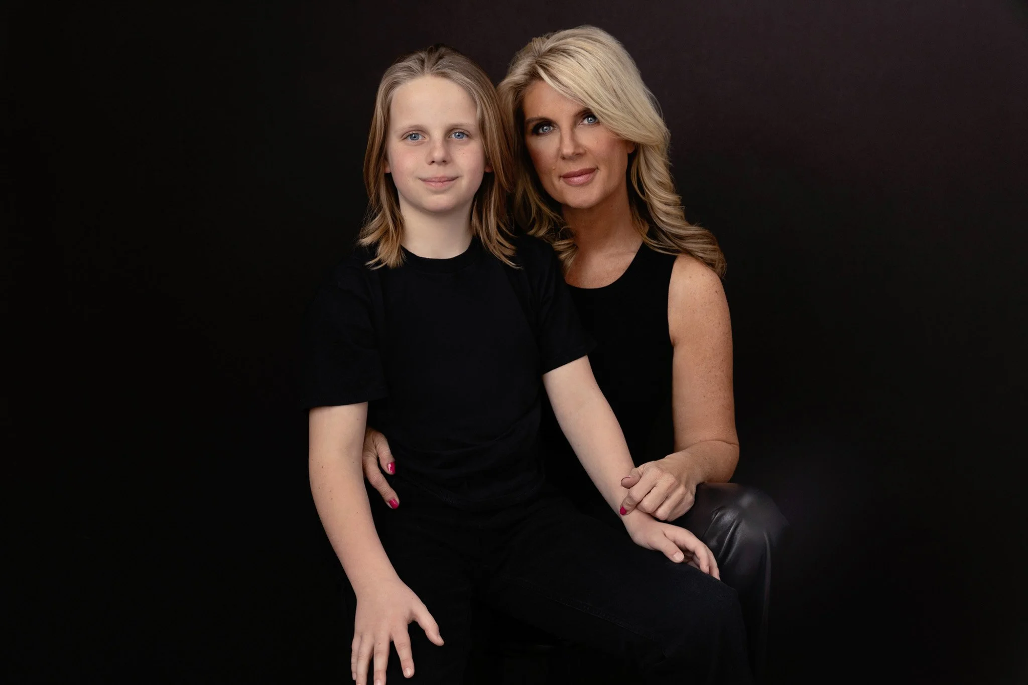 Blonde mother and her child in coordinating black, Nashville mother-and-child portrait by Judith Hill