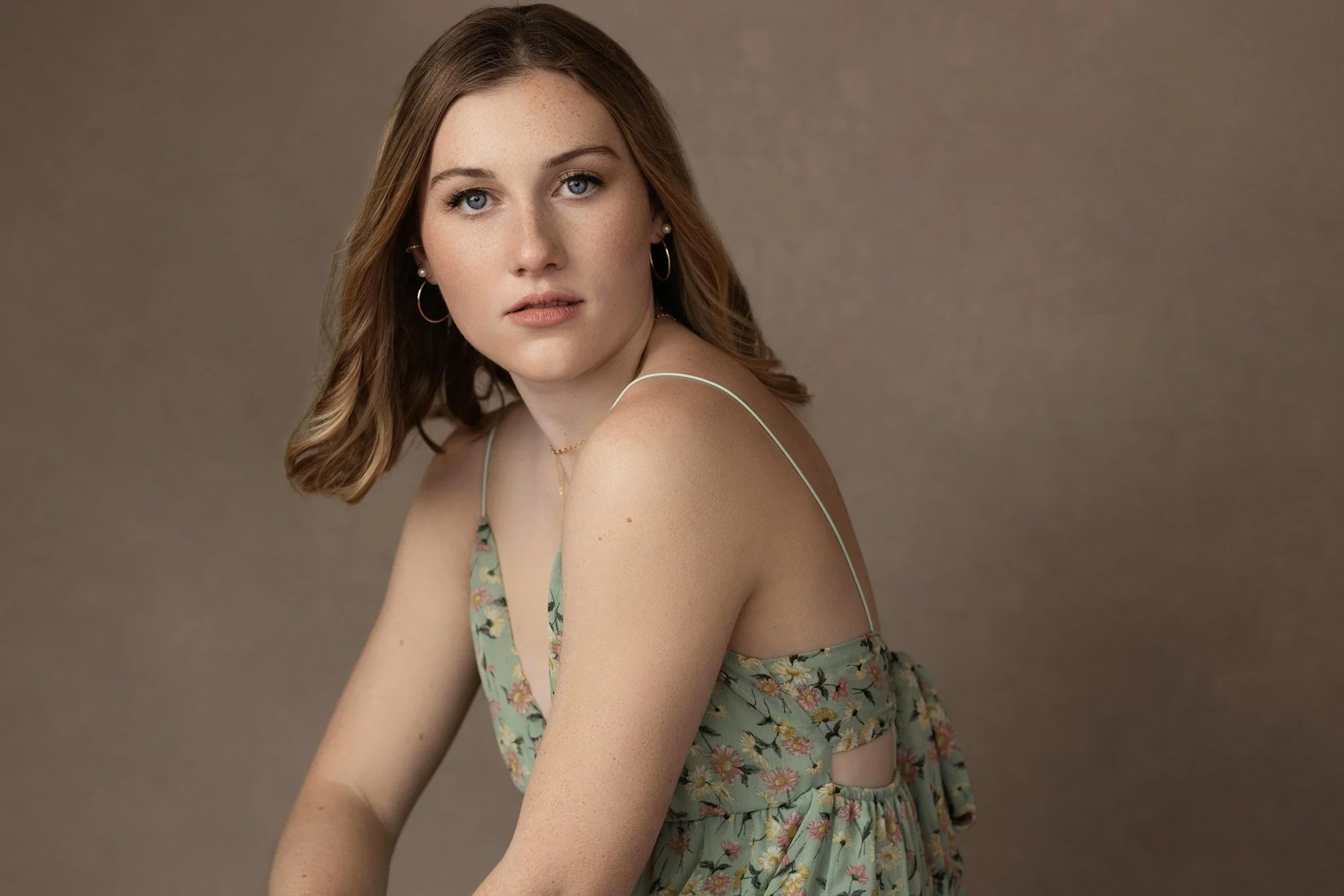 Young woman in a green floral dress, Nashville studio portrait by Judith Hill