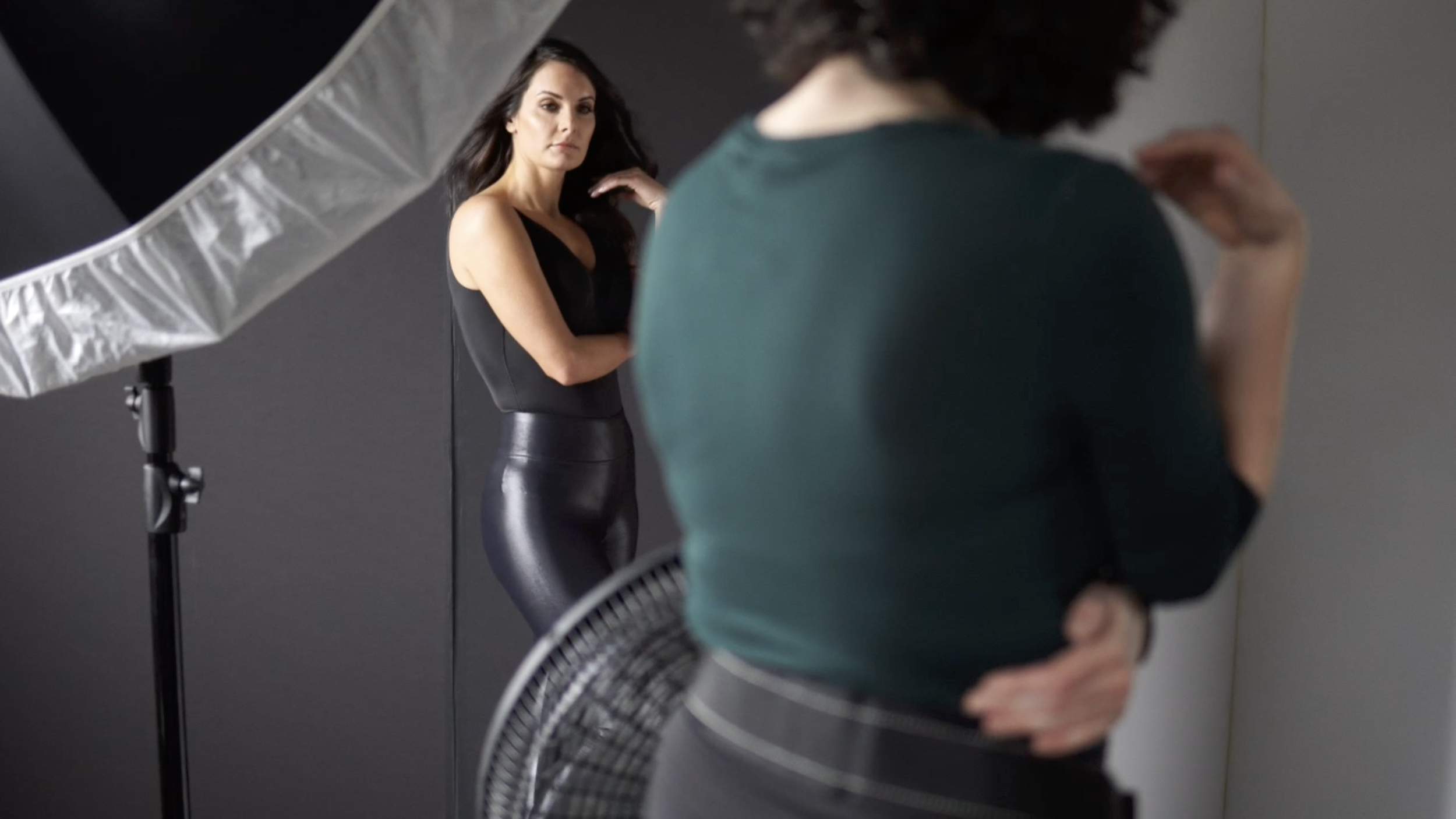 BTS Image of Judith Hill Photography posing a woman h=in her 40s in her Nashville portrait studio.