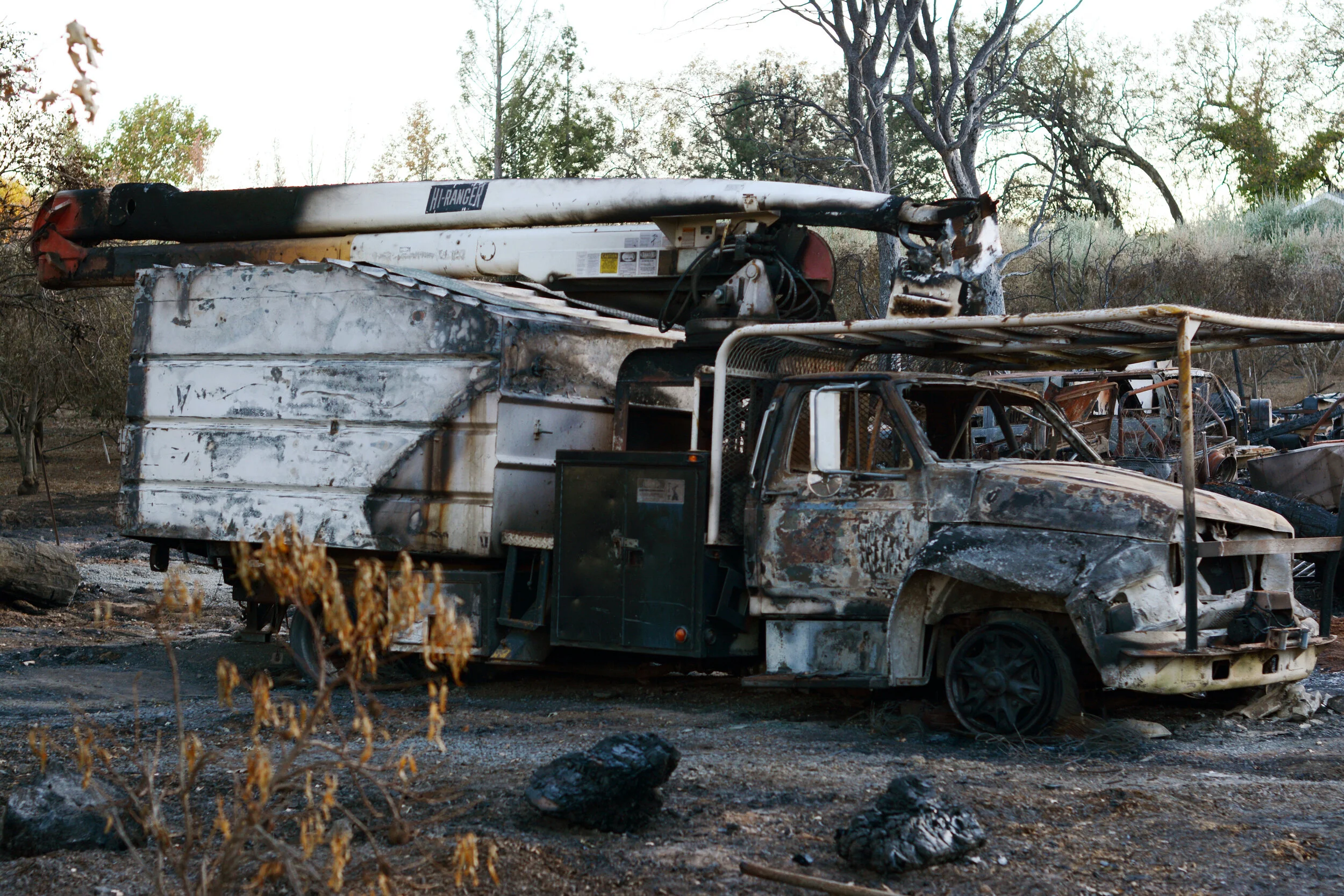 A scorched car sits parked on the side of Chalk Hill Road in Healdsburg, Sonoma County. The Kincade wildfire threatened 90,000 structures at its peak. Photo by Eric Fang
