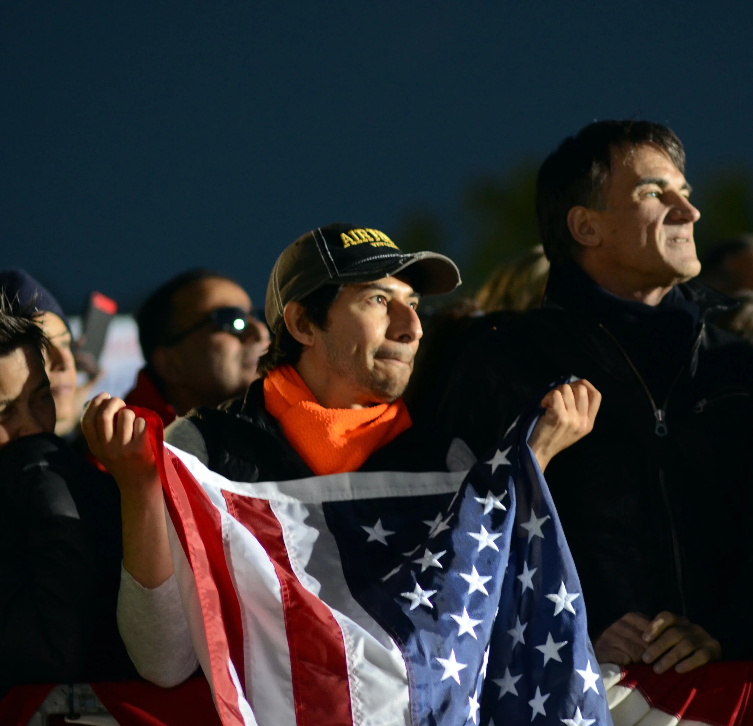 A spectator holds up an American flag at an Elizabeth Warren presidential campaign rally in Oakland, Calif. on May 31. In her rally speech before a crowd of several thousand spectators, Warren advocated for policy changes like education reform, univ…
