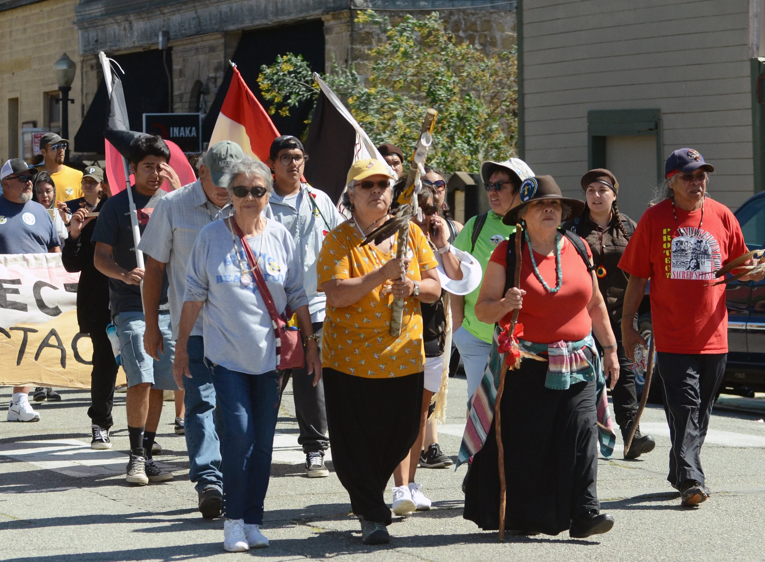 Castro leads a group of activists on their march through downtown San Juan Bautista. She emphasized her tribe’s responsibility to preserve Juristac for future generations. Photo by Eric Fang