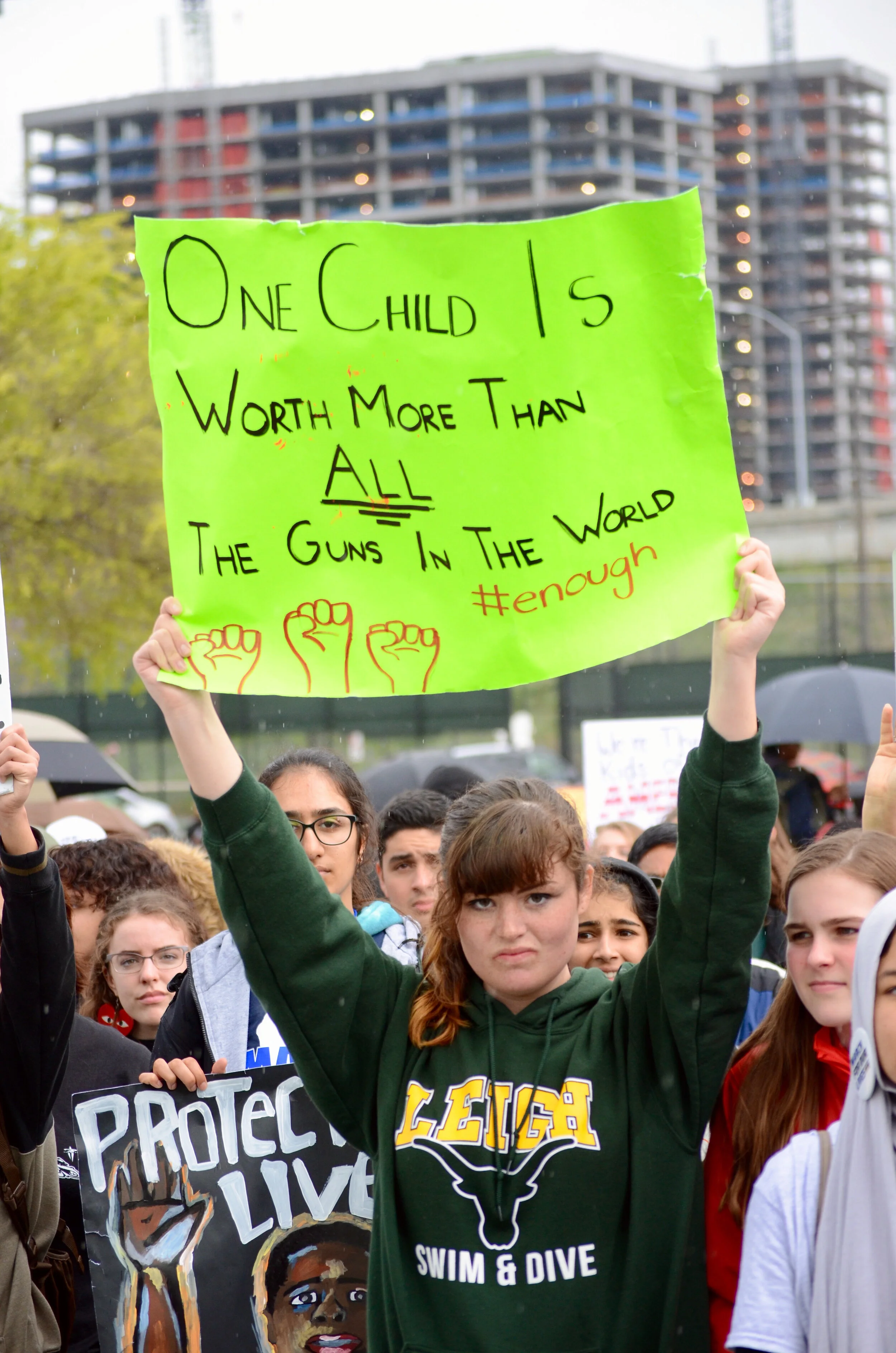 A student from Leigh High School holds up a sign in protest during the March for Our Lives rally in San Jose. The Bay Area joined cities across the U.S. in holding youth-led marches protesting gun violence. Photo by Eric Fang