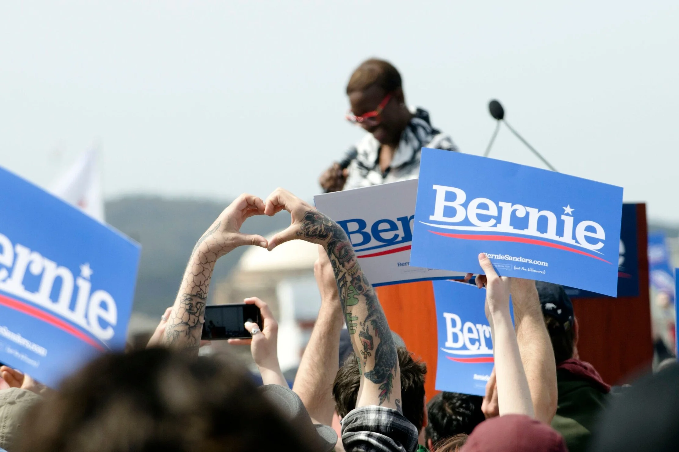 A Bernie Sanders supporter holds up a heart prior to Sanders’ speech at a San Francisco, Calif. rally on March 24. In his rally speech, Sanders called for limitations on corporate power and greater accountability by the government. Photo by Eric Fang