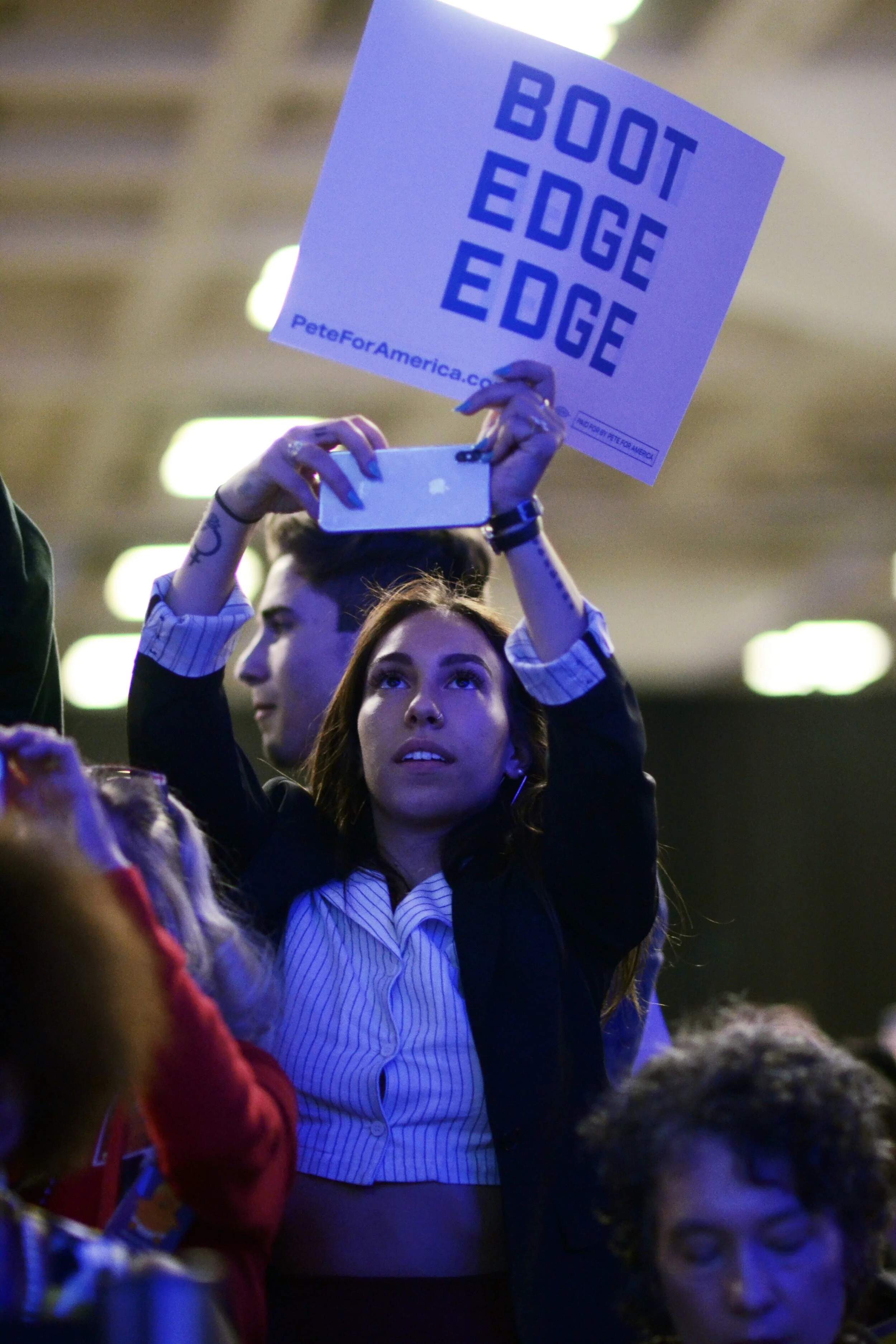 A supporter of mayor Pete Buttigieg raises a sign in support of Buttigieg’s speech at the California Democratic State Convention. Buttigieg won 13 of the 56 total Democratic delegates after the Iowa primaries and caucuses, more than any other Democr…