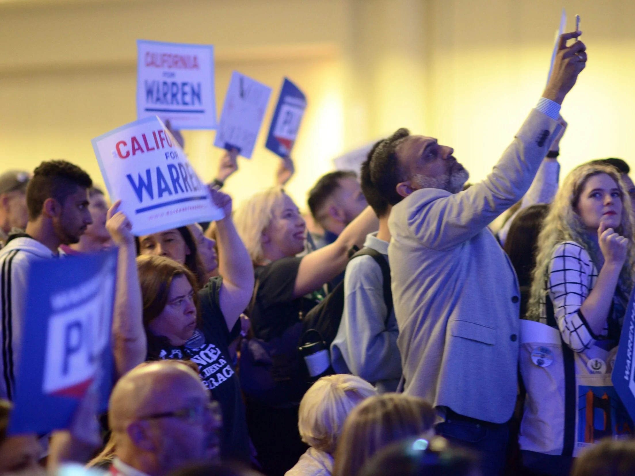 Audience members at the California Democratic Convention on June 2, 2019 raise banners in support of their respective candidates. Sen. Kamala Harris (D-Calif) spoke to the audience before any other presidential candidate. Photo by Eric Fang