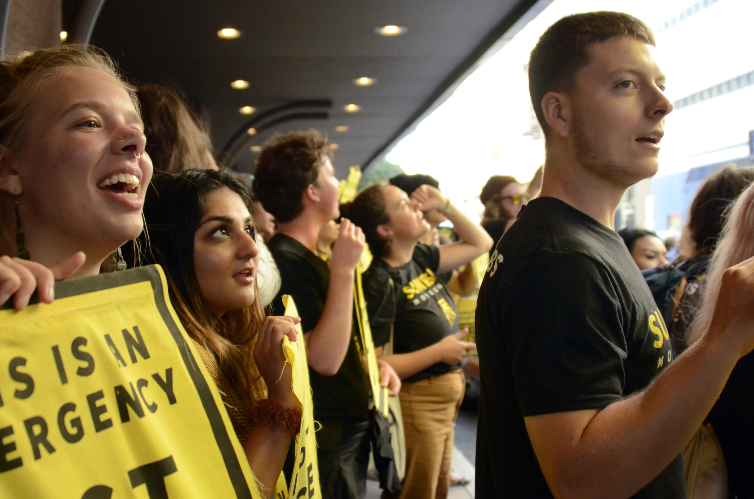 Sunrise Movement activists chant slogans outside the Democratic National Committee summer meeting in San Francisco on Aug. 26, 2019. The activists called for a Democratic presidential candidate debate centered solely on the issue of climate change. …