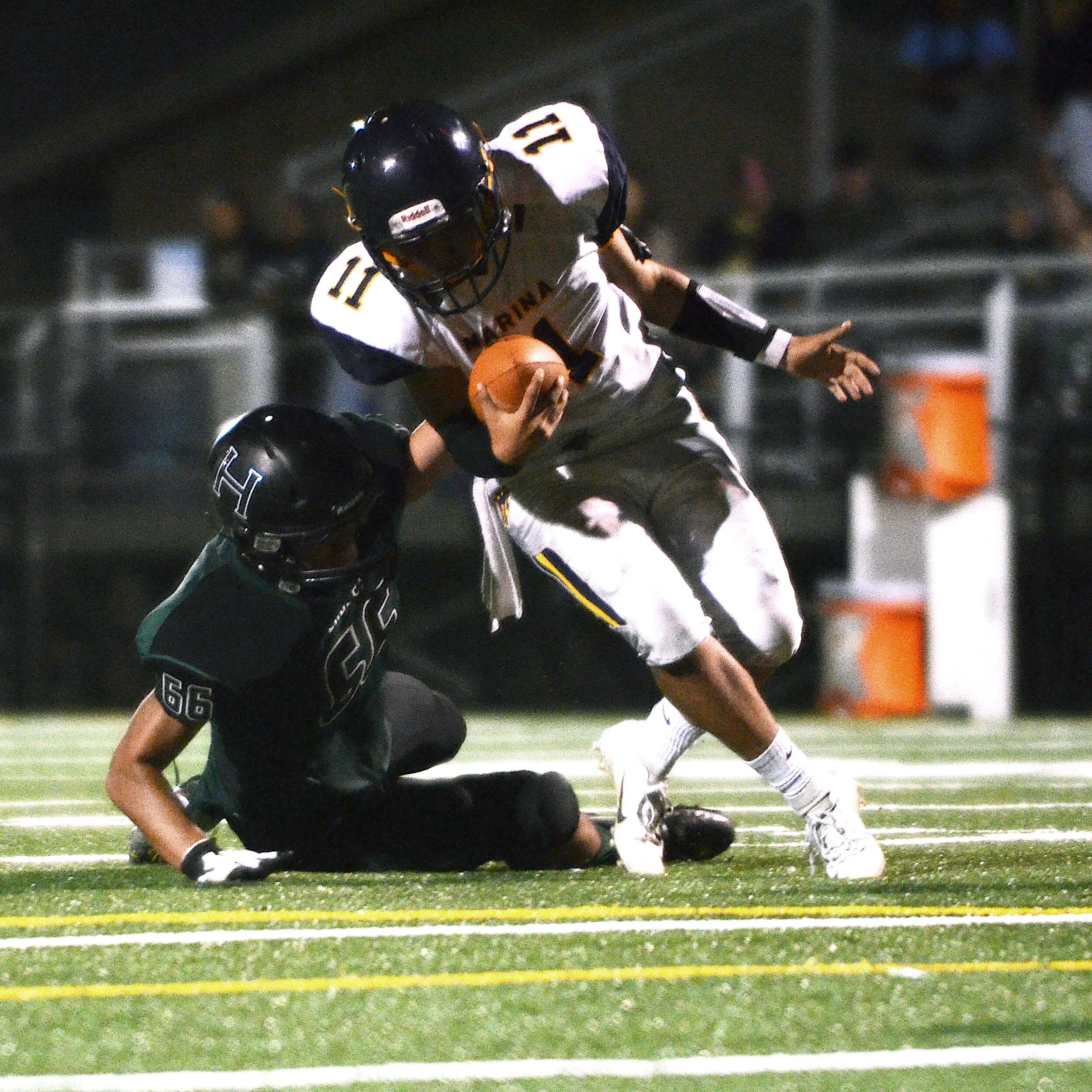 A Harker defender tackles an opposing receiver during a home game against Marina High School on Sept. 6, 2018. Marina High School lost 26-2 against the Eagles. Photo by Eric Fang