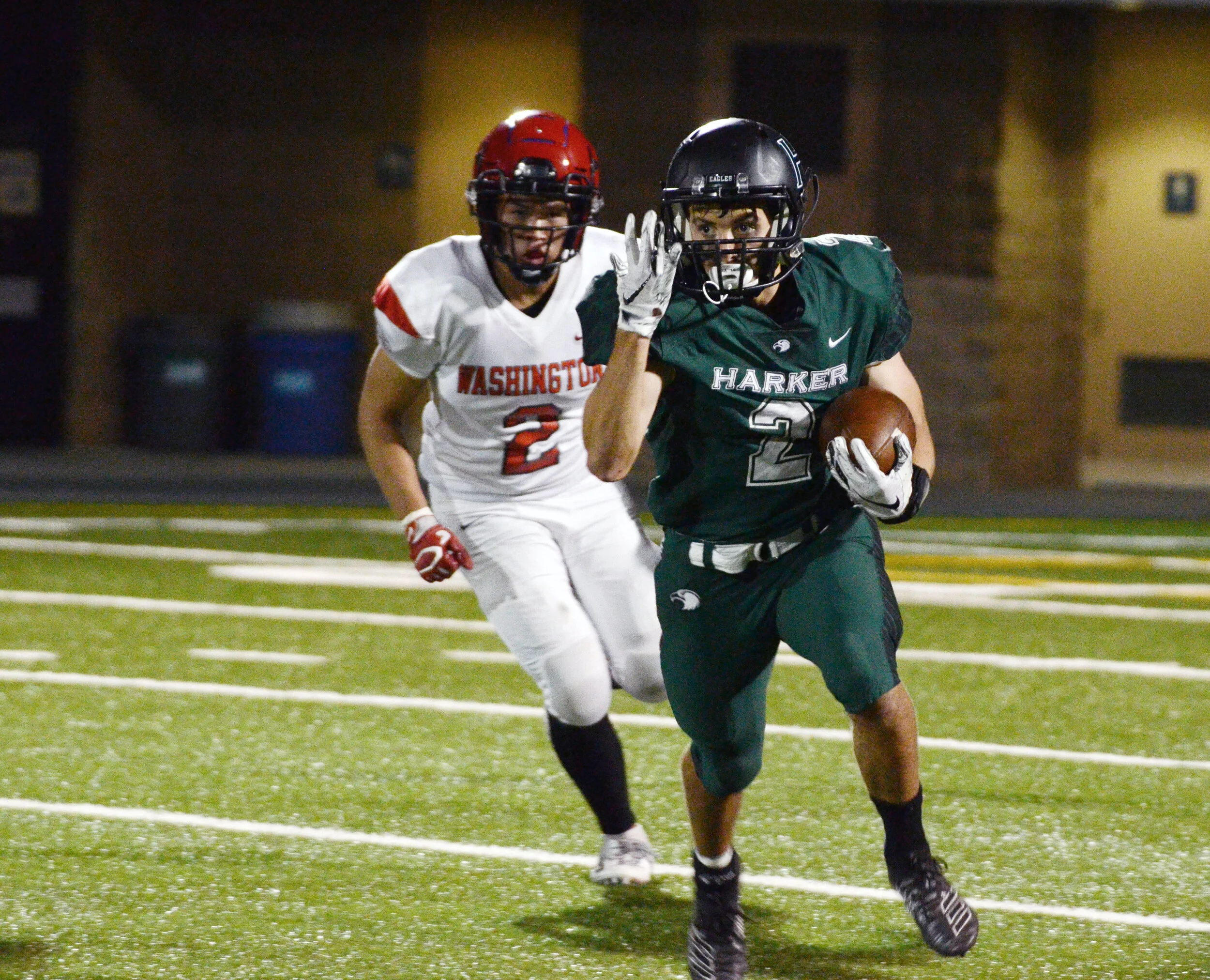 A Harker running back out sprints an opposing defender during a home game against Washington High School on Sept. 6, 2019. The varsity football team appointed three team captains for the 2019-2020 season. Photo by Eric Fang