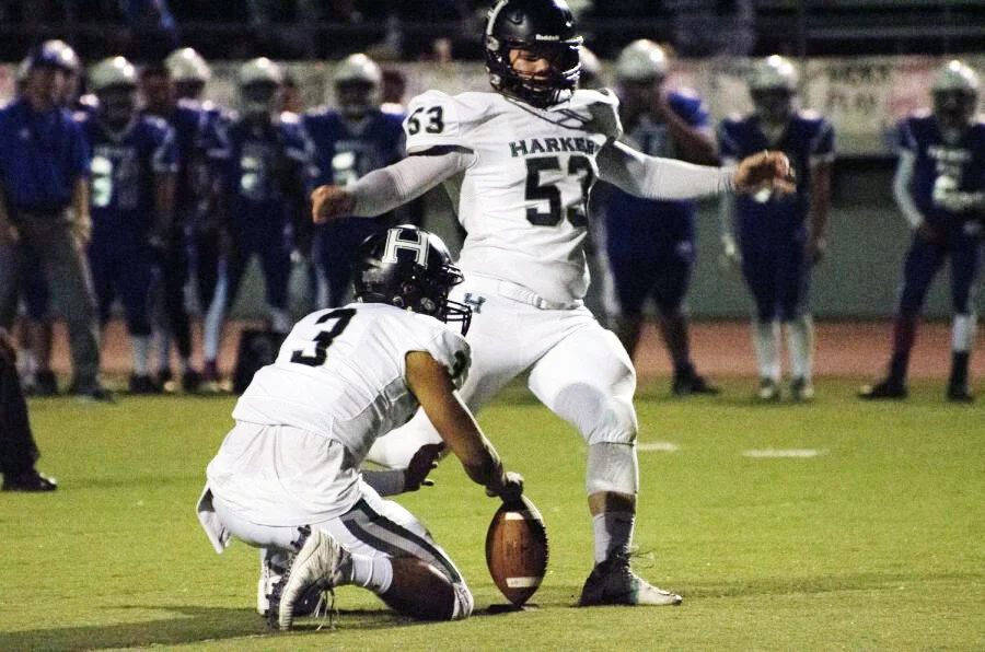 Harker varsity football team kicker attempts to score an extra point during an away game against Marina High School on Sept. 29, 2017. The football team remained undefeated until their last and final game against Hercules High School on Nov. 25, 201…