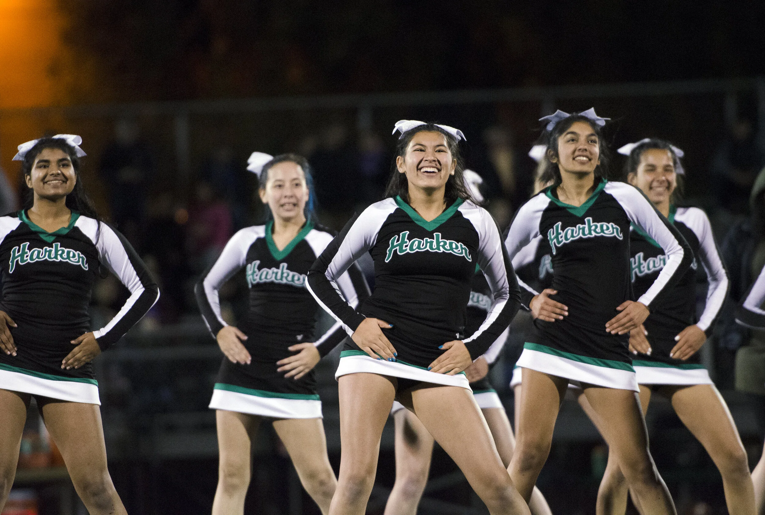 Harker cheerleaders perform for the audience during a home game against Tamalpais High School on Oct. 6, 2017. Harker cheerleaders support the Harker football team during both home and away games. Photo by Eric Fang