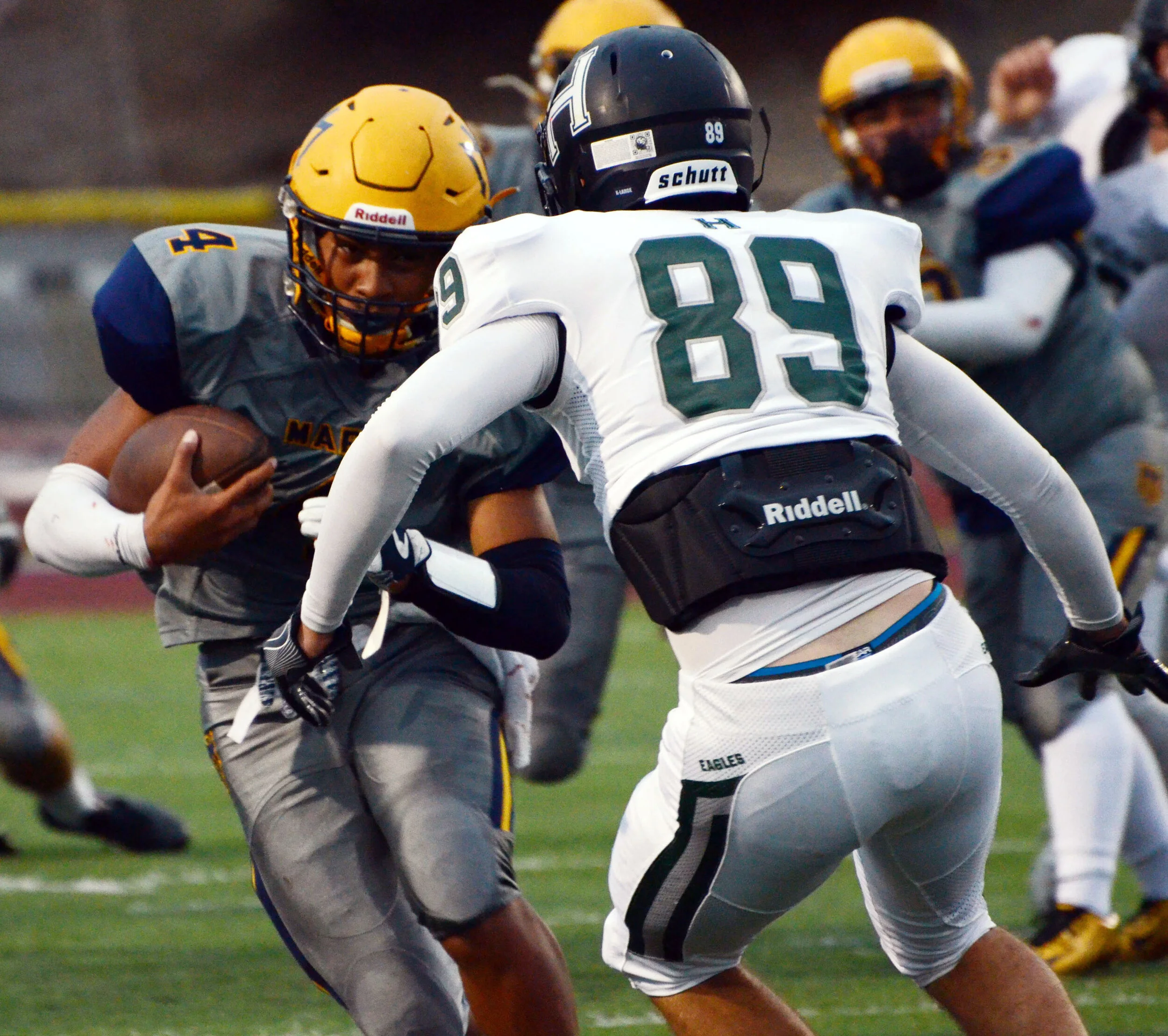 A Marina High School football player with possession of the ball braces for a tackle during a game on Sept. 29, 2017. Marina lost to the Harker Eagles 0-30. Photo by Eric Fang