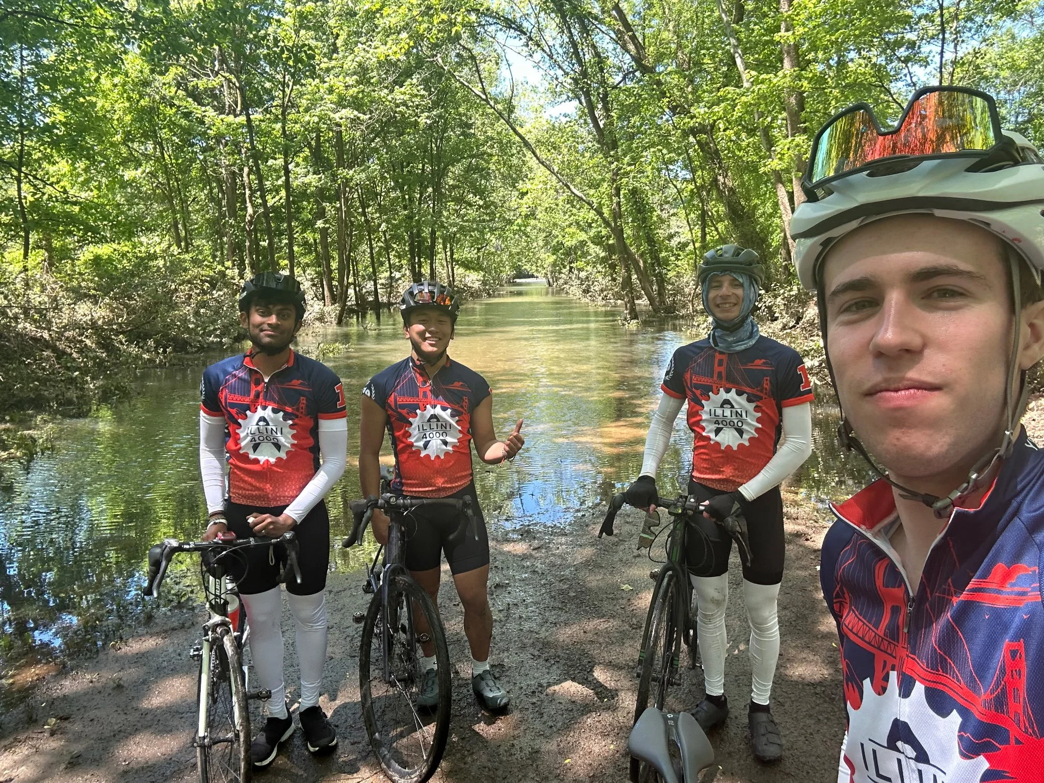  (from left to right) Nishk, Max, Anthony, and Cole showing just how badly flooded the trail got. 
