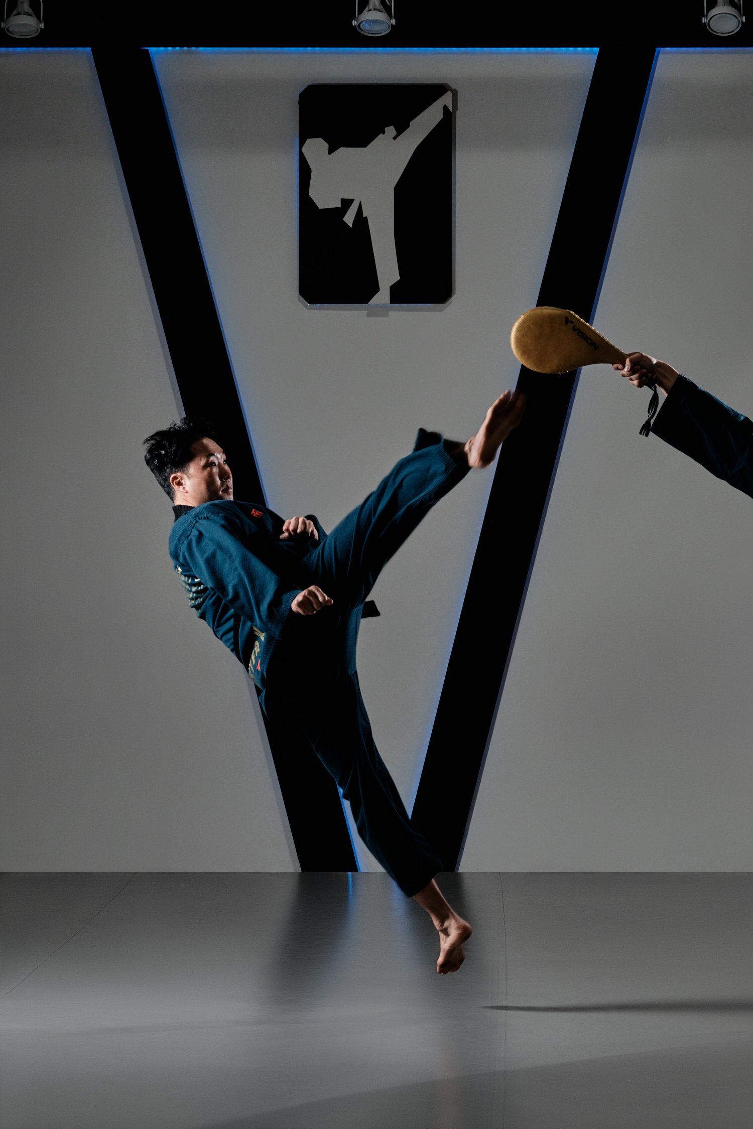 Taekwondo master mid-kick.