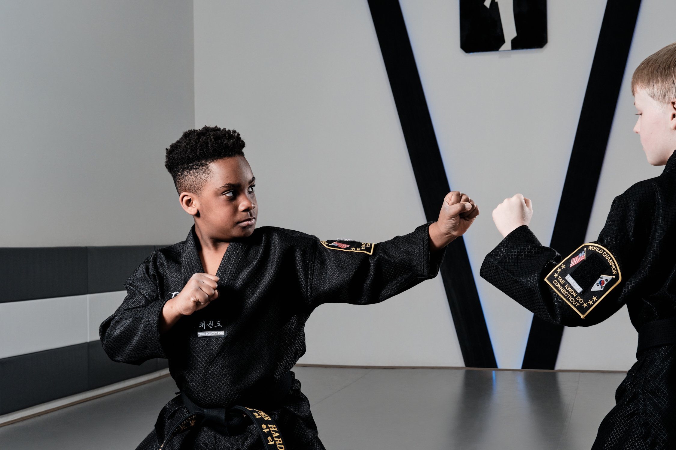 Young taekwondo student sparring.