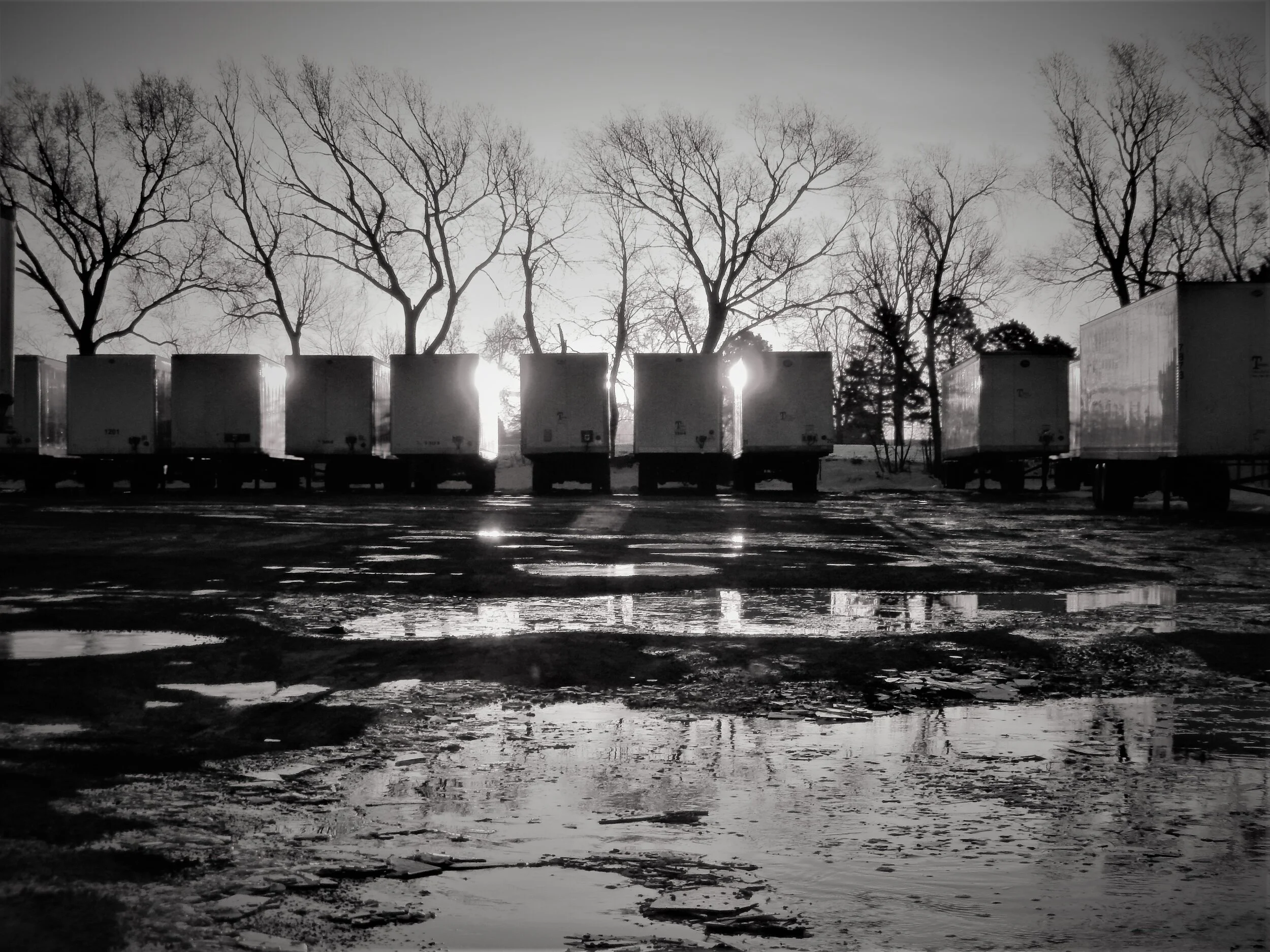  A row of trailers at sunrise. 
