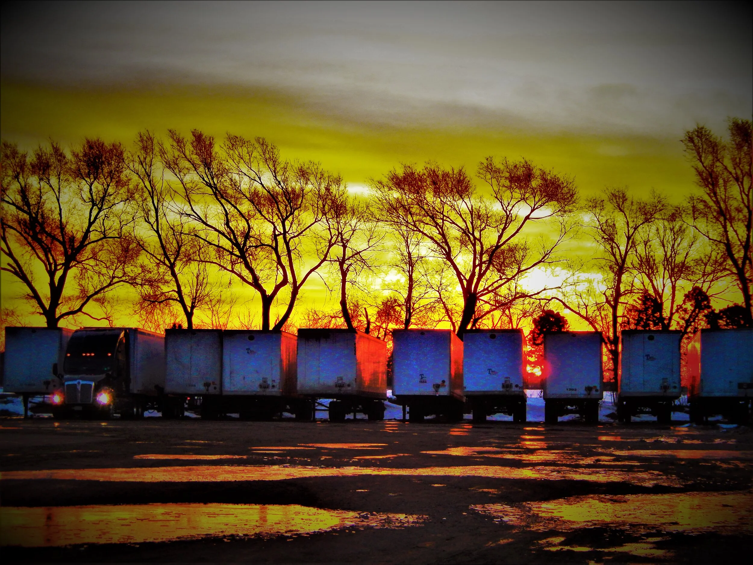  A row of trailers at sunrise. 