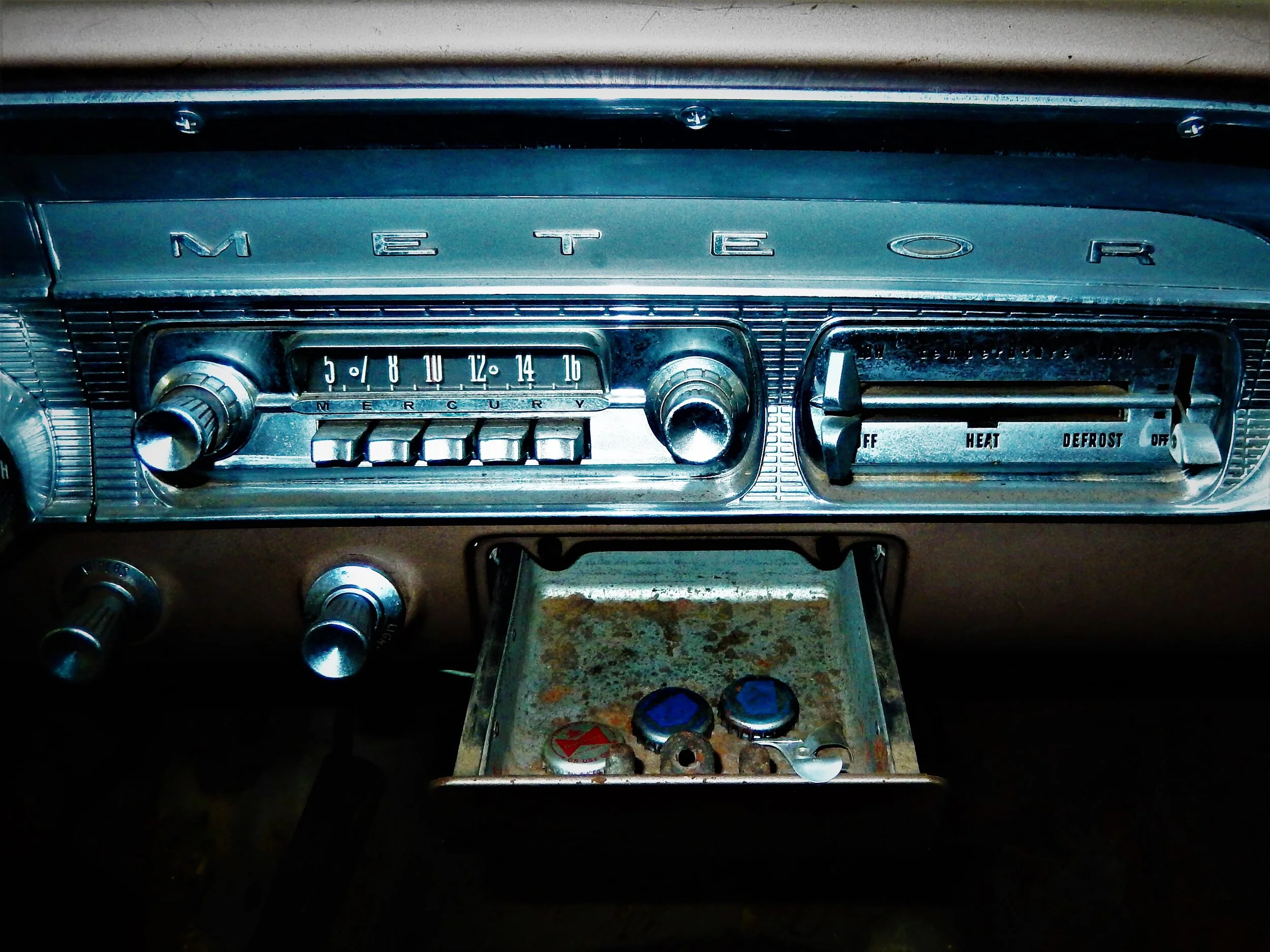 Bottle caps inside a Mercury Meteor ashtray. 