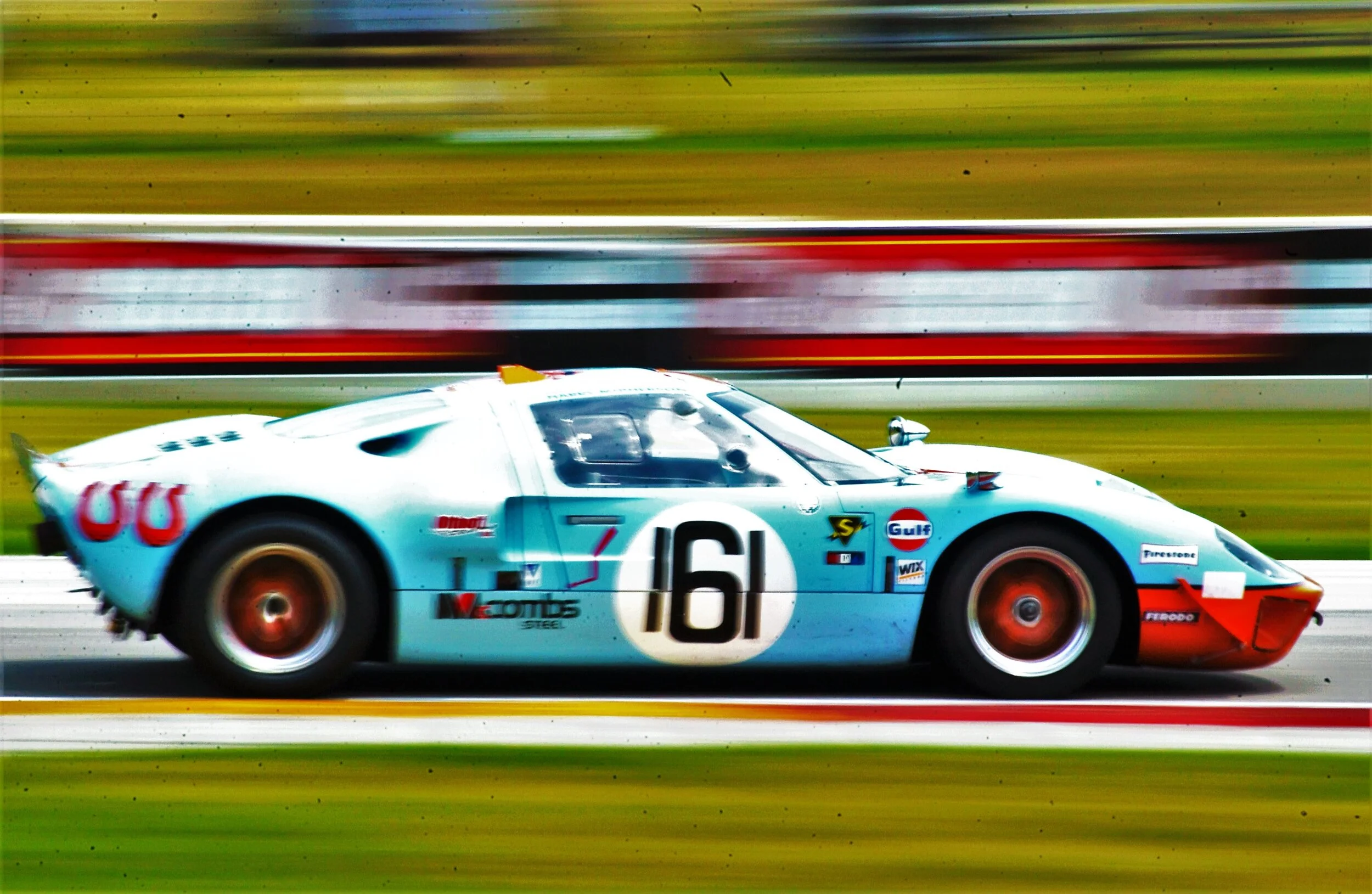  Ford GT40 racing at Road America near Elkhart Lake, Wisconsin. 