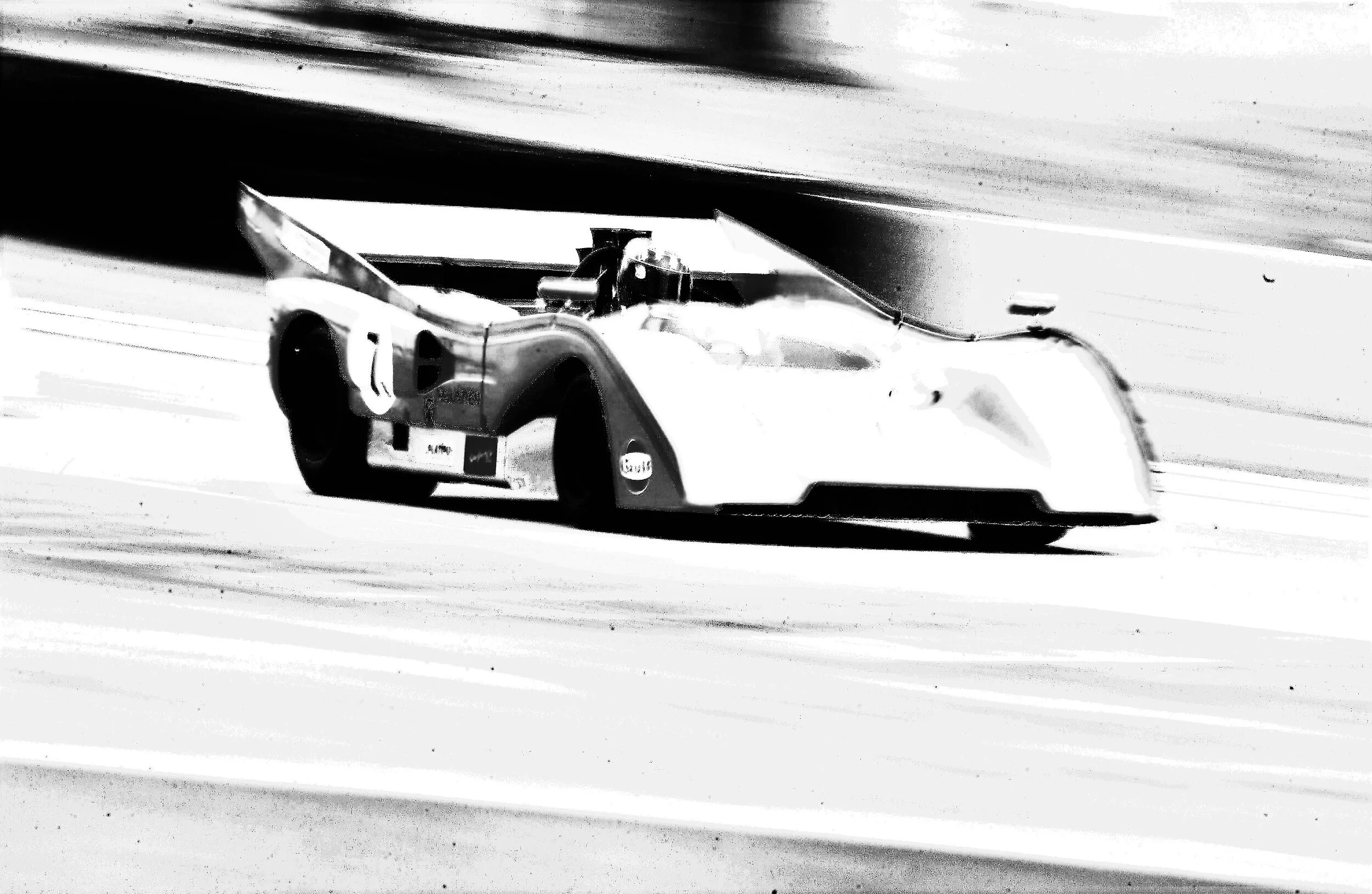  McLaren Can Am race car at speed at Road America. 