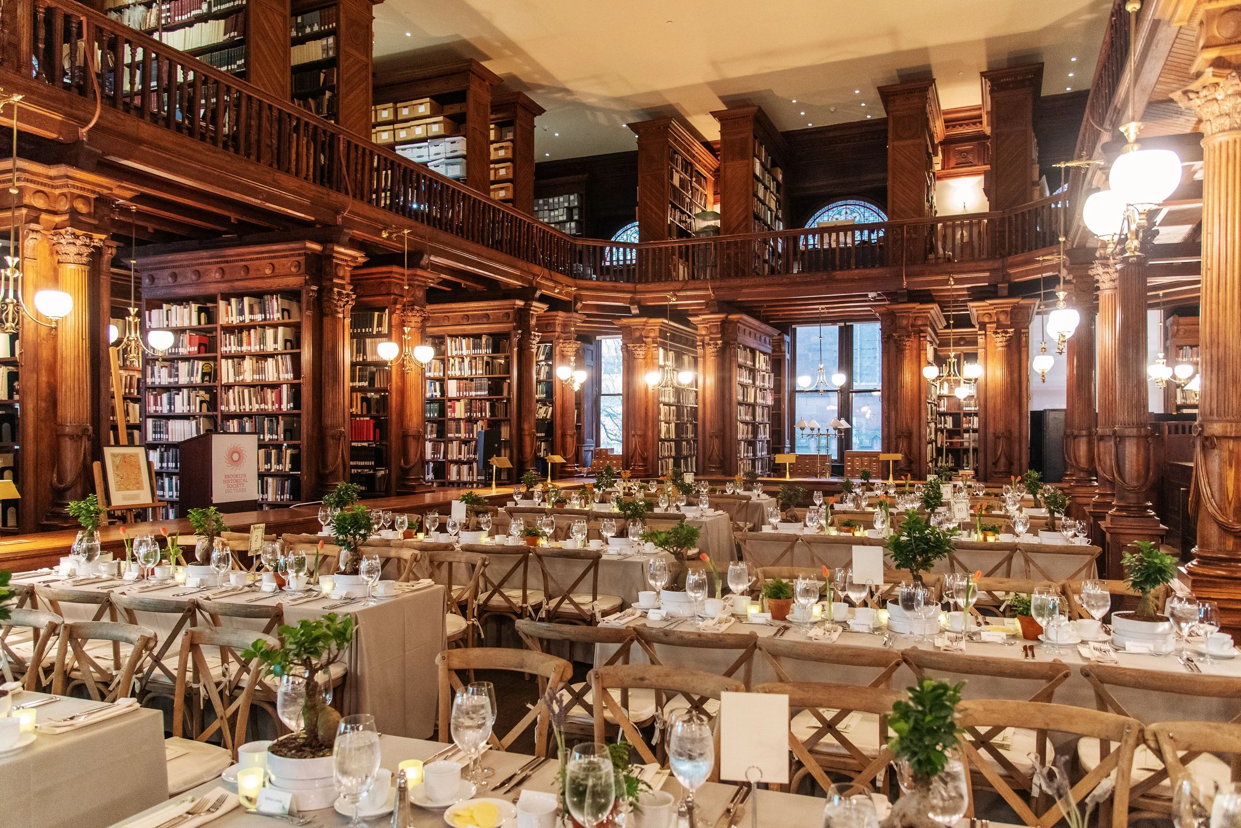 historical library with stained glass windows event venue set for sustainable catering