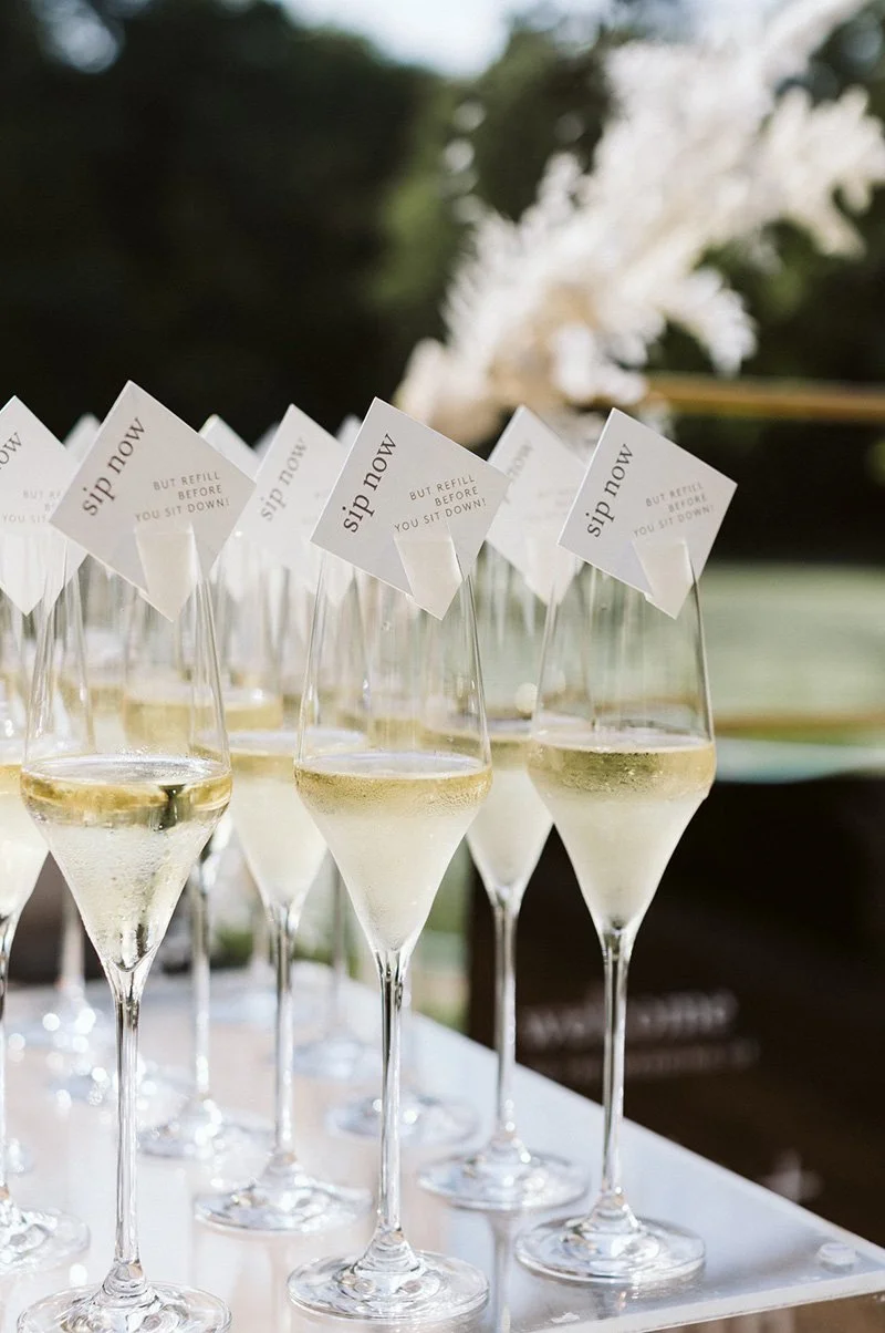 champagne glasses with reception notes at outdoor NYC wedding