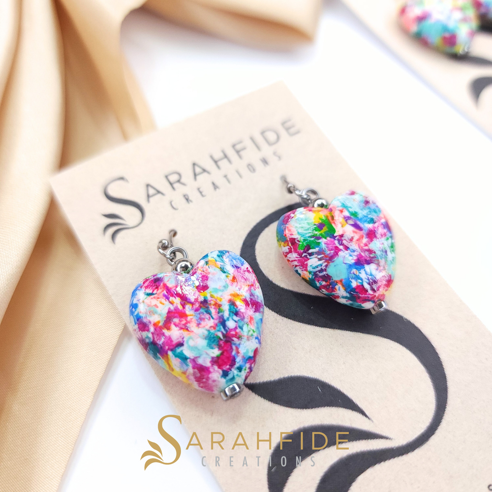 Colorful hearts, anyone? These vibrant heart earrings feature Sarah's signature Garden Goddess color palette - a beautiful mix of colors hand-painted with a high gloss finish that catches the light. Each heart brings all the happy, colorful energy! L