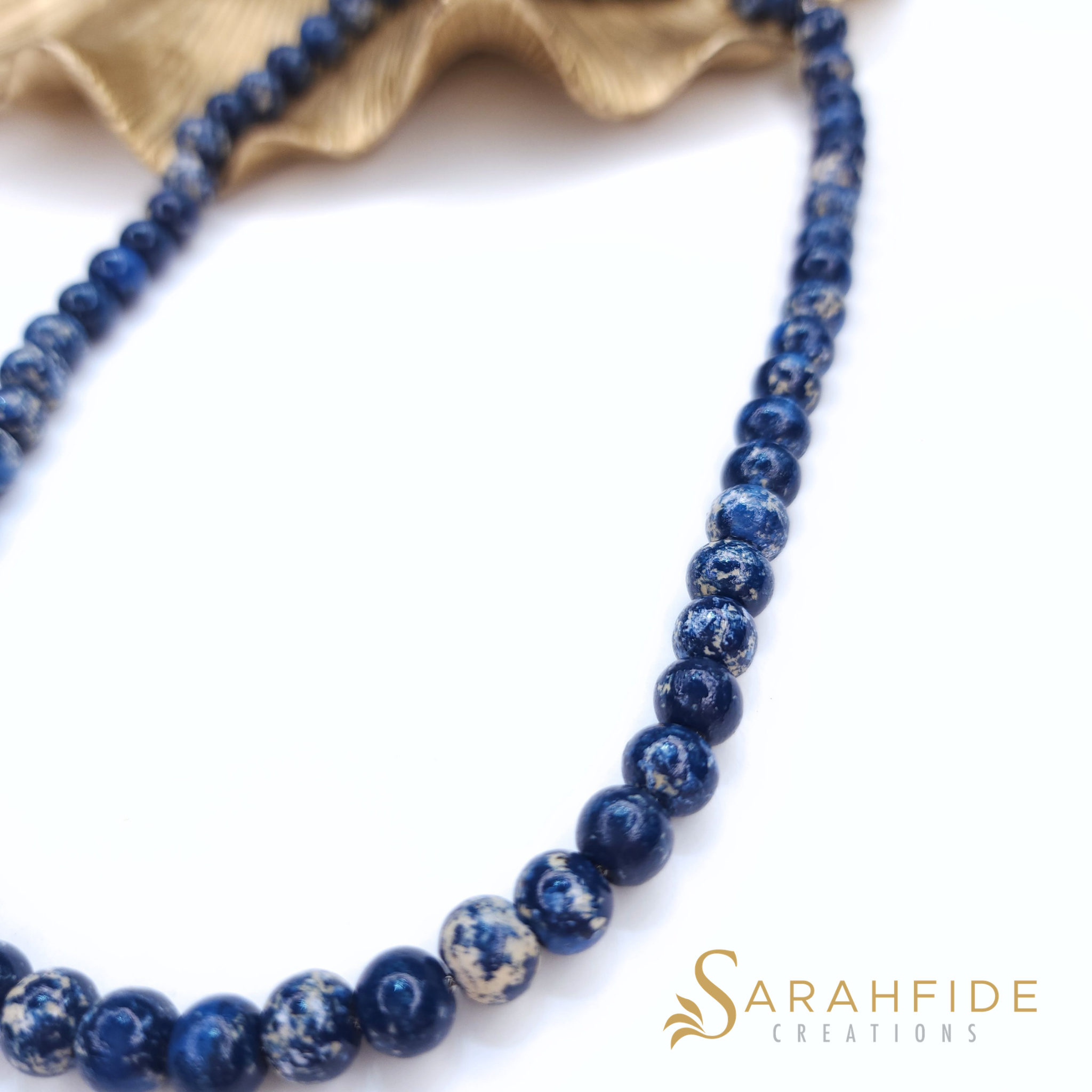 Close-up of denim blue beaded necklace