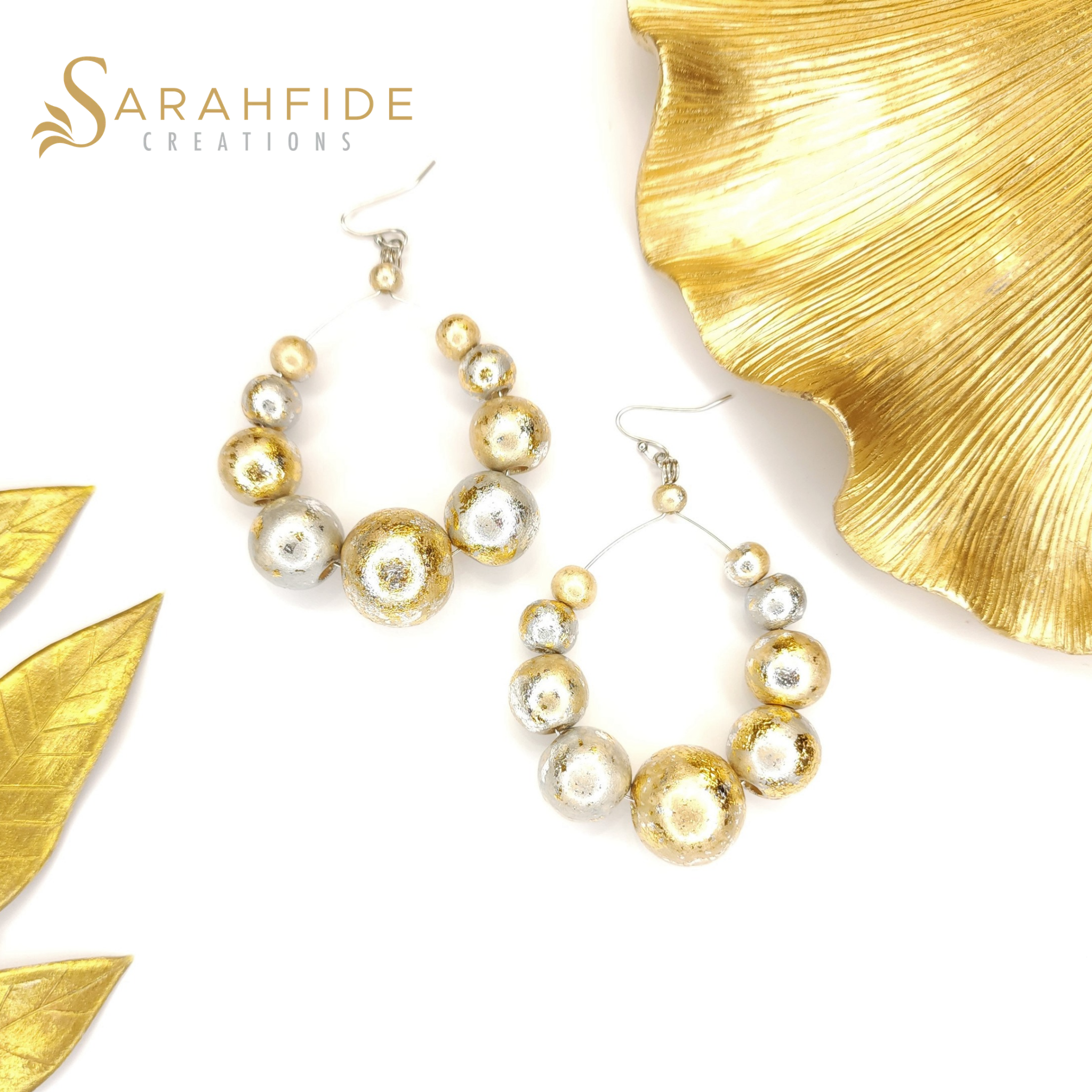 Sparkling Large Round Drop Earrings laid flat, gold and silver sparkling wood beads
