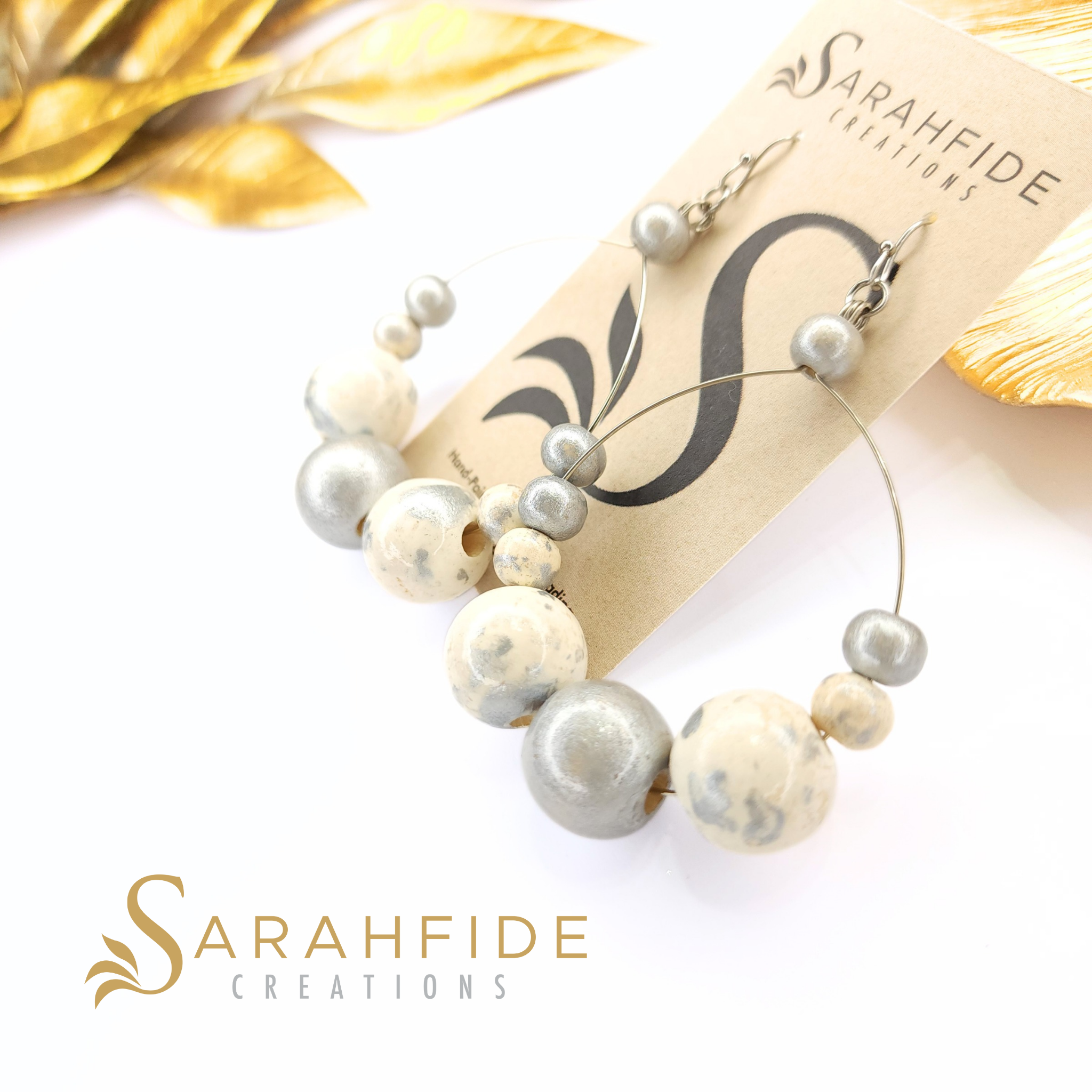 Silver Lux Large Round Drop Earrings on a Sarahfide card, warm white and silver hand-painted wood beads