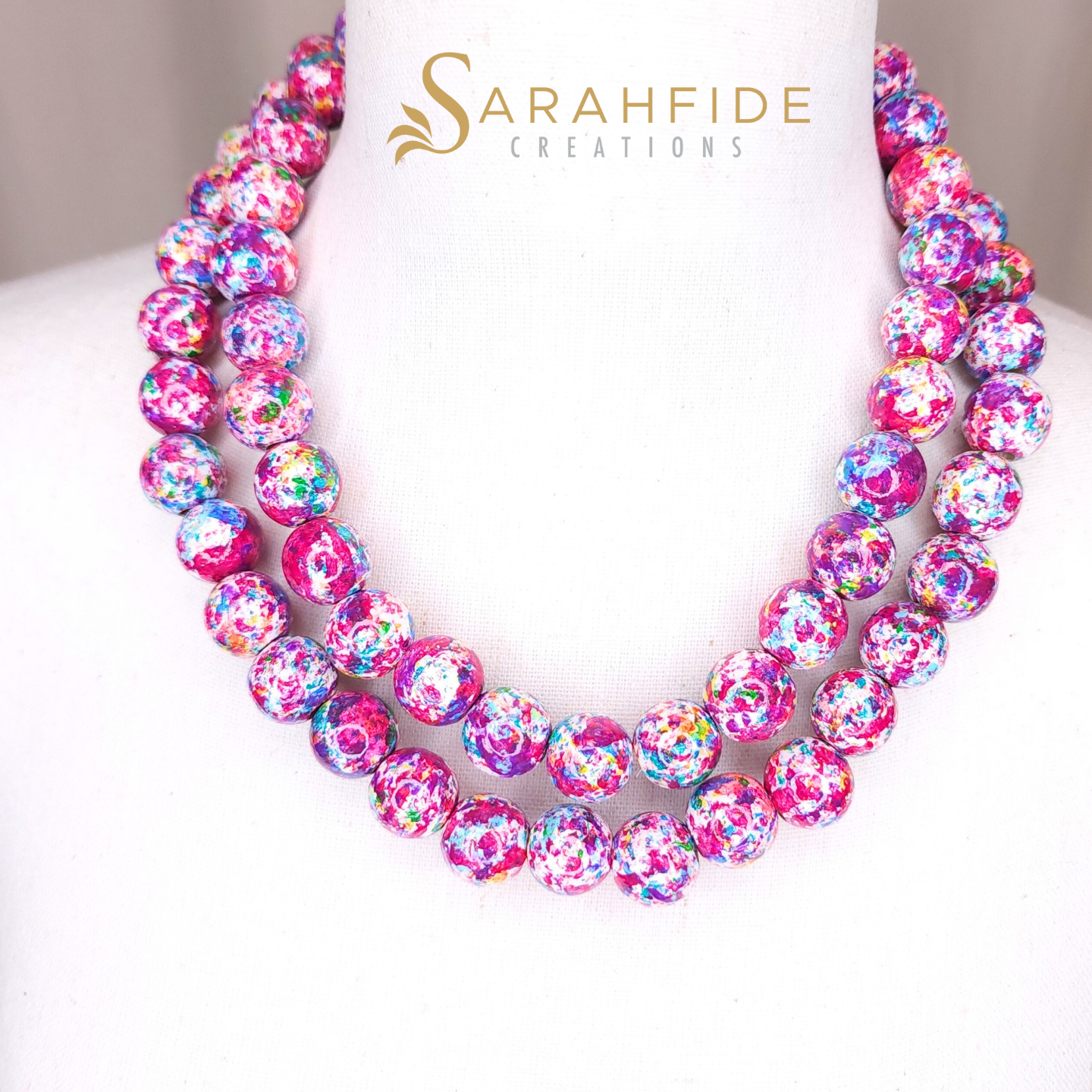 Our number one selling paint design, Garden Goddess, in the signature line showcasing a beautiful array of colors inspired by a vibrant garden, with a striking emphasis on a rich pink hue. Each piece is meticulously hand-painted, capturing the essenc