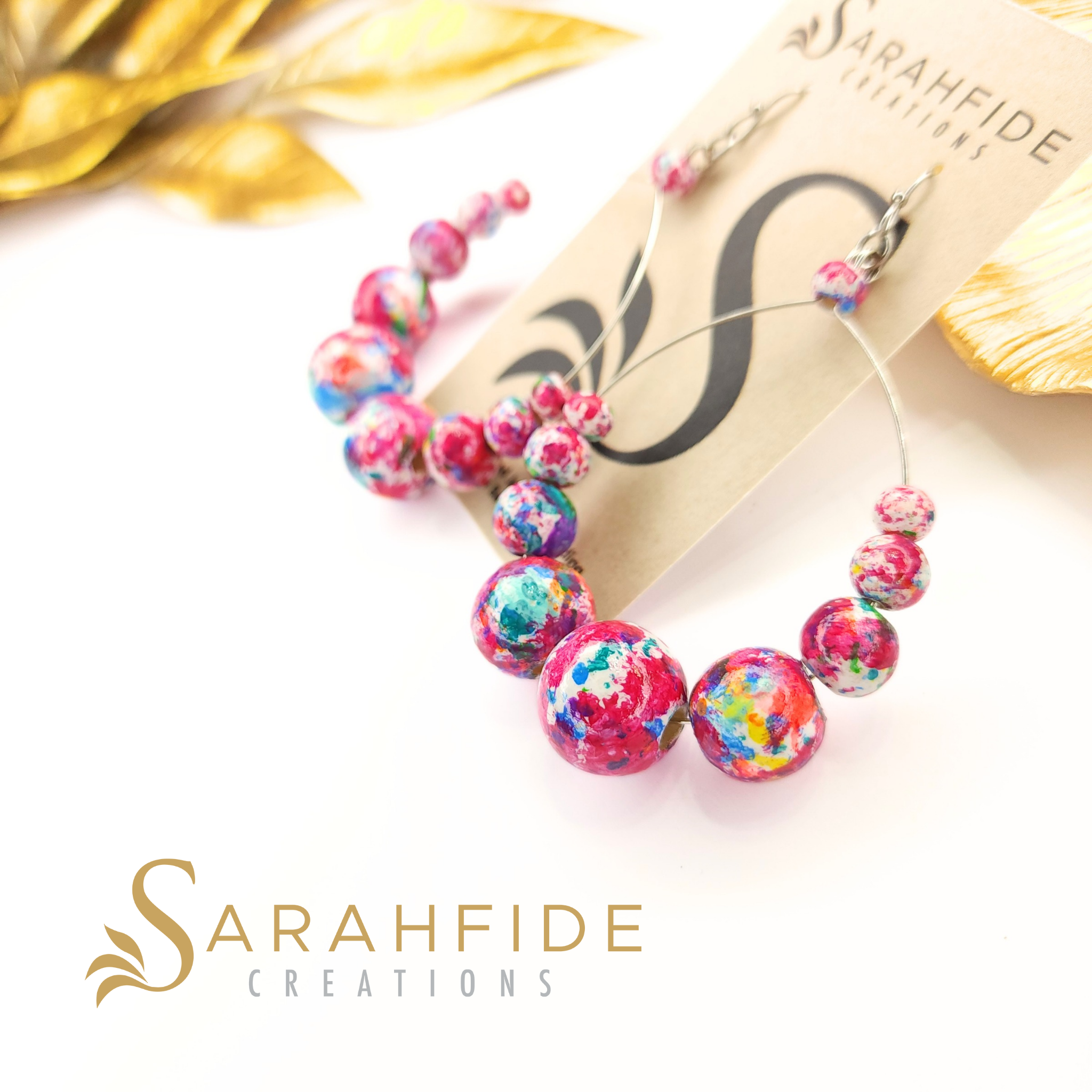 Garden Goddess Large Round Drop Earrings on a Sarahfide card, colorful hand-painted wood beads