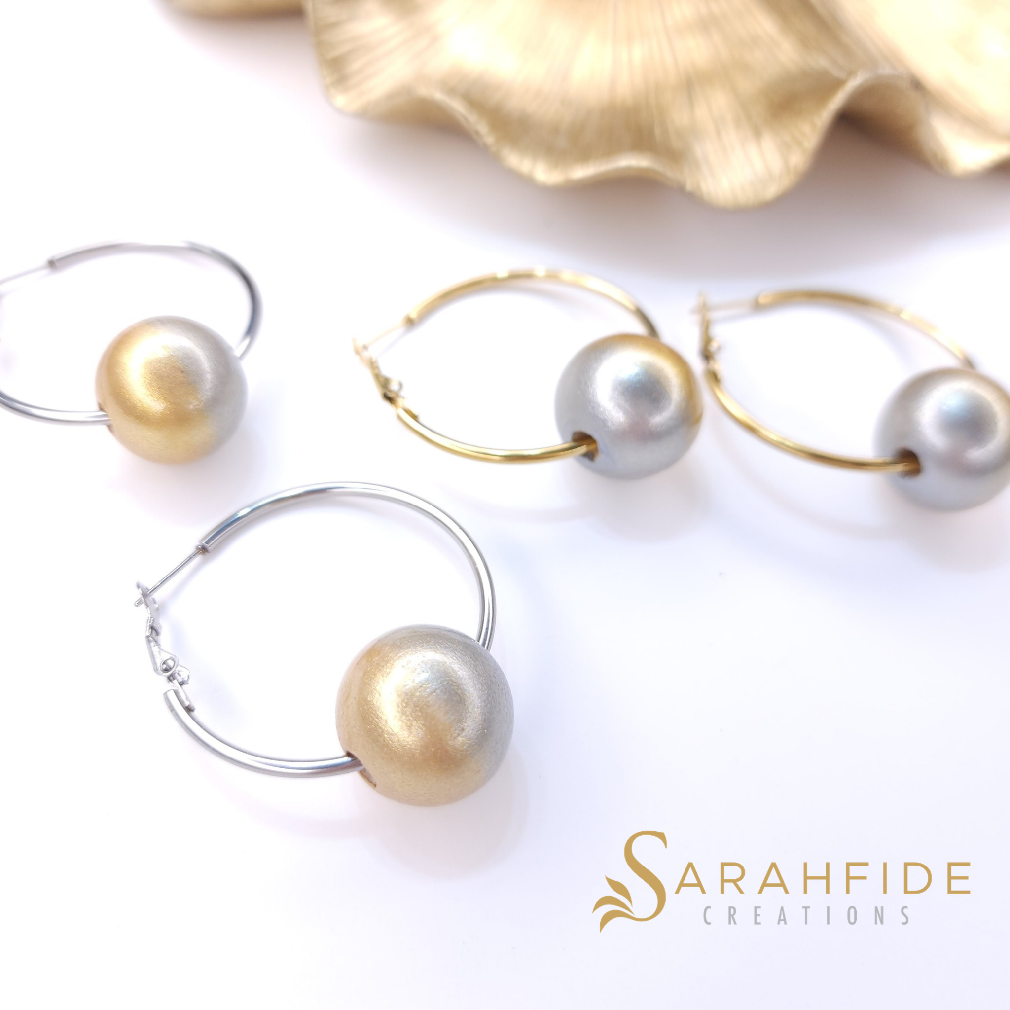 Close up of Platinum Bougie Hoop Earrings, 20mm hand-painted wood beads