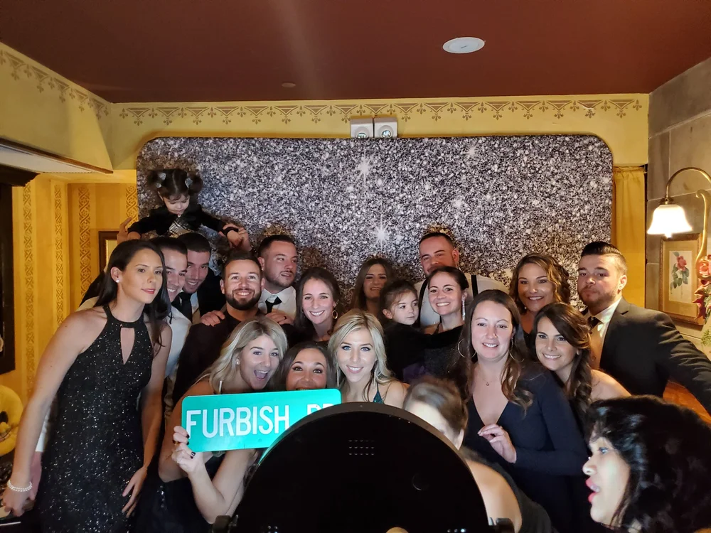 Party guests posing together at the IKSounds photo booth