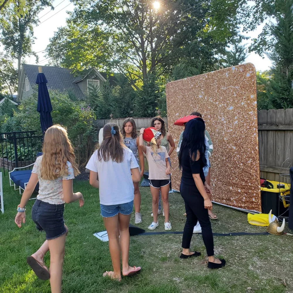 Young guests celebrating at an outdoor birthday party
