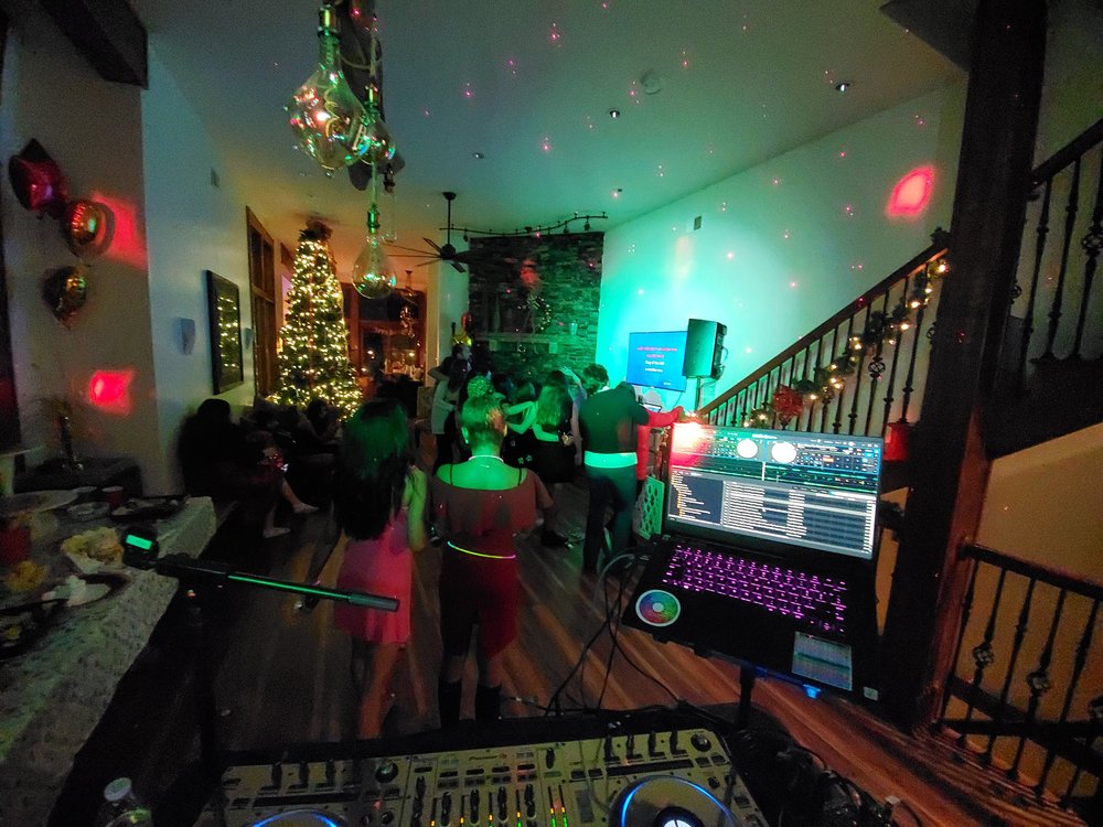 Guests gathered around the karaoke display at an IKSounds birthday party