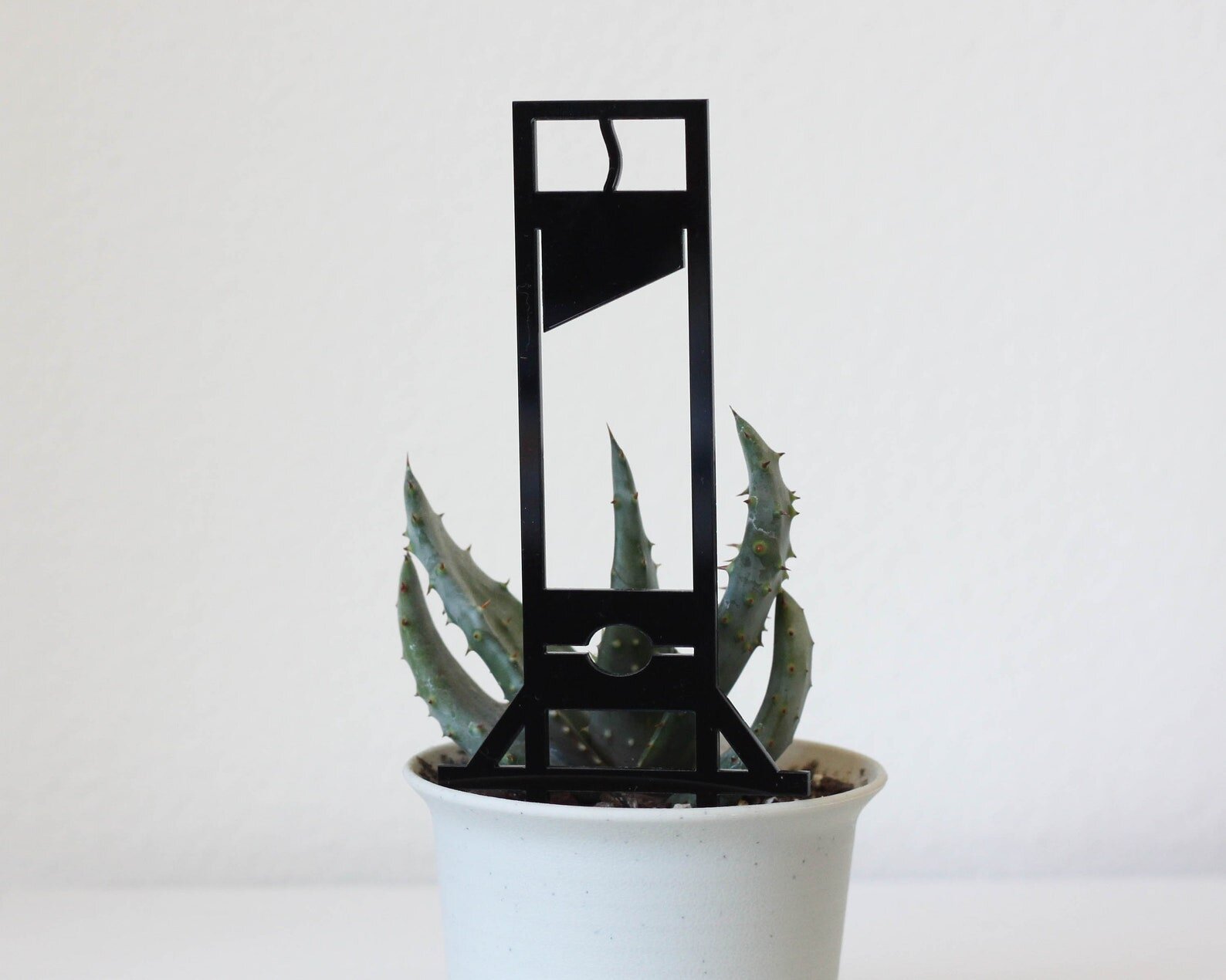 Guillotine Garden Stake | $9