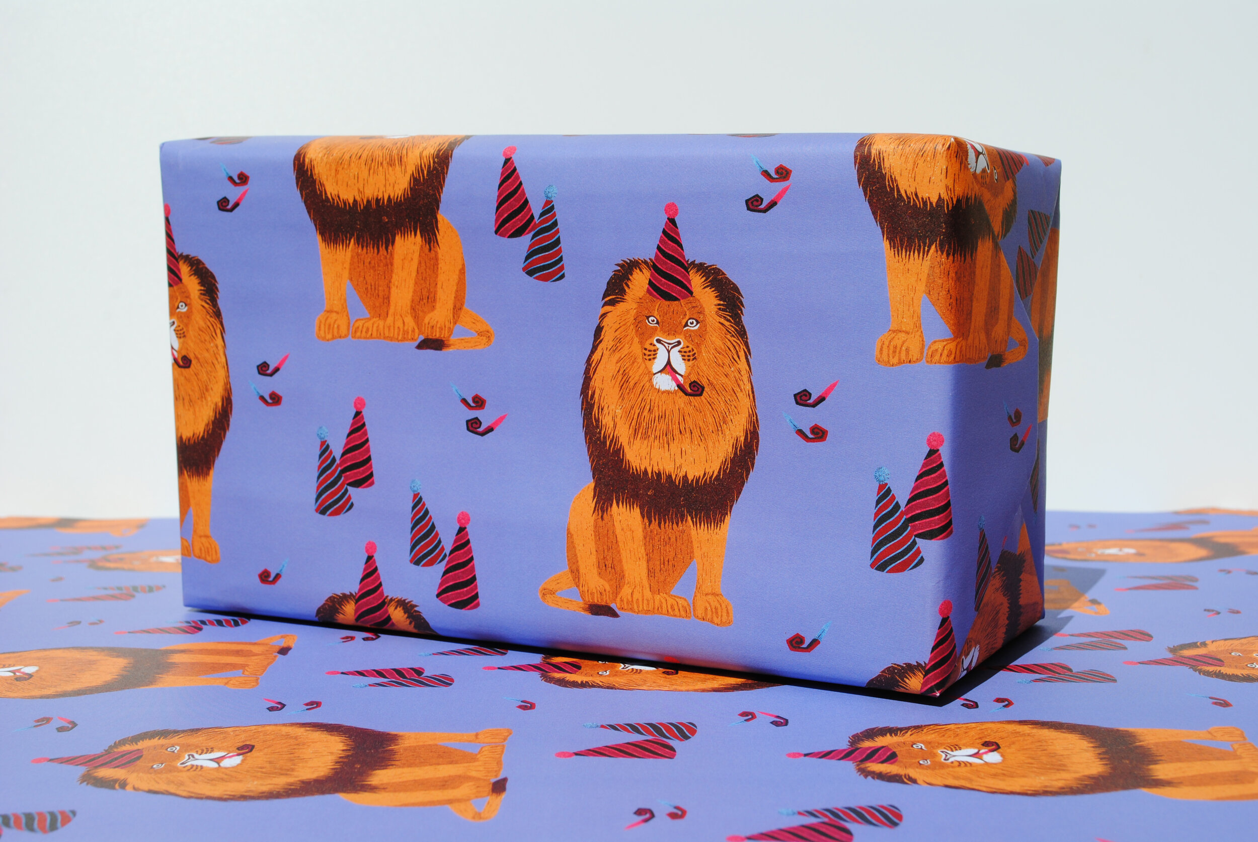 Party lion gift wrap on top of wrap.jpg