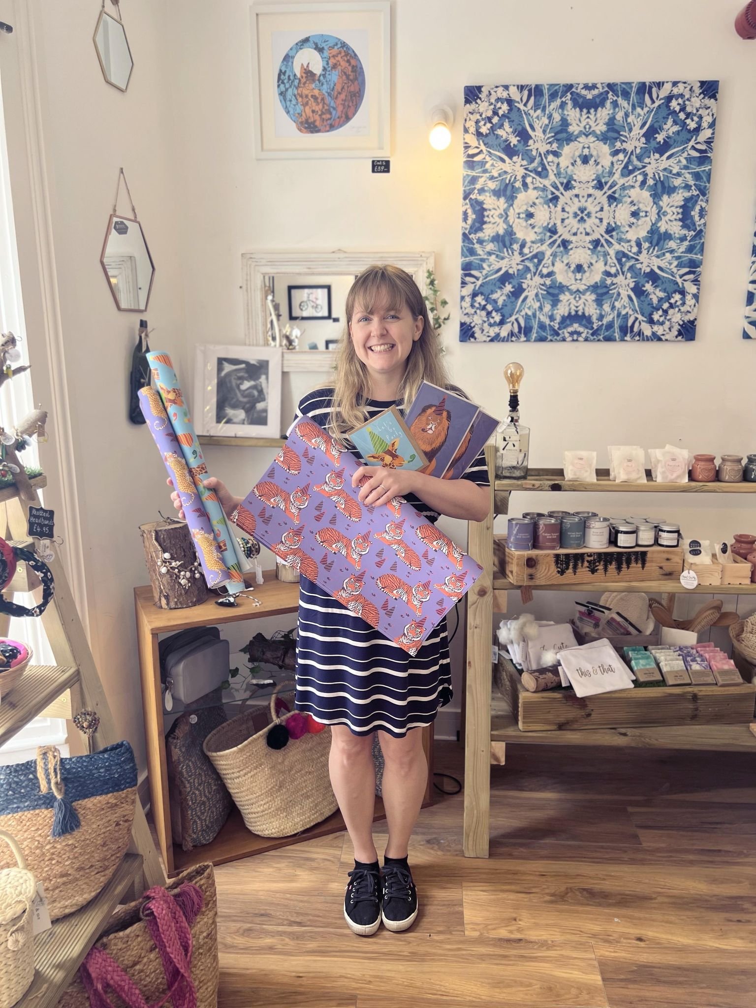 Corrina Ann Art Wholesale Order. Corrina Holding her Wholesale Order of Animal Wrapping Paper and Greeting Cards.jpg