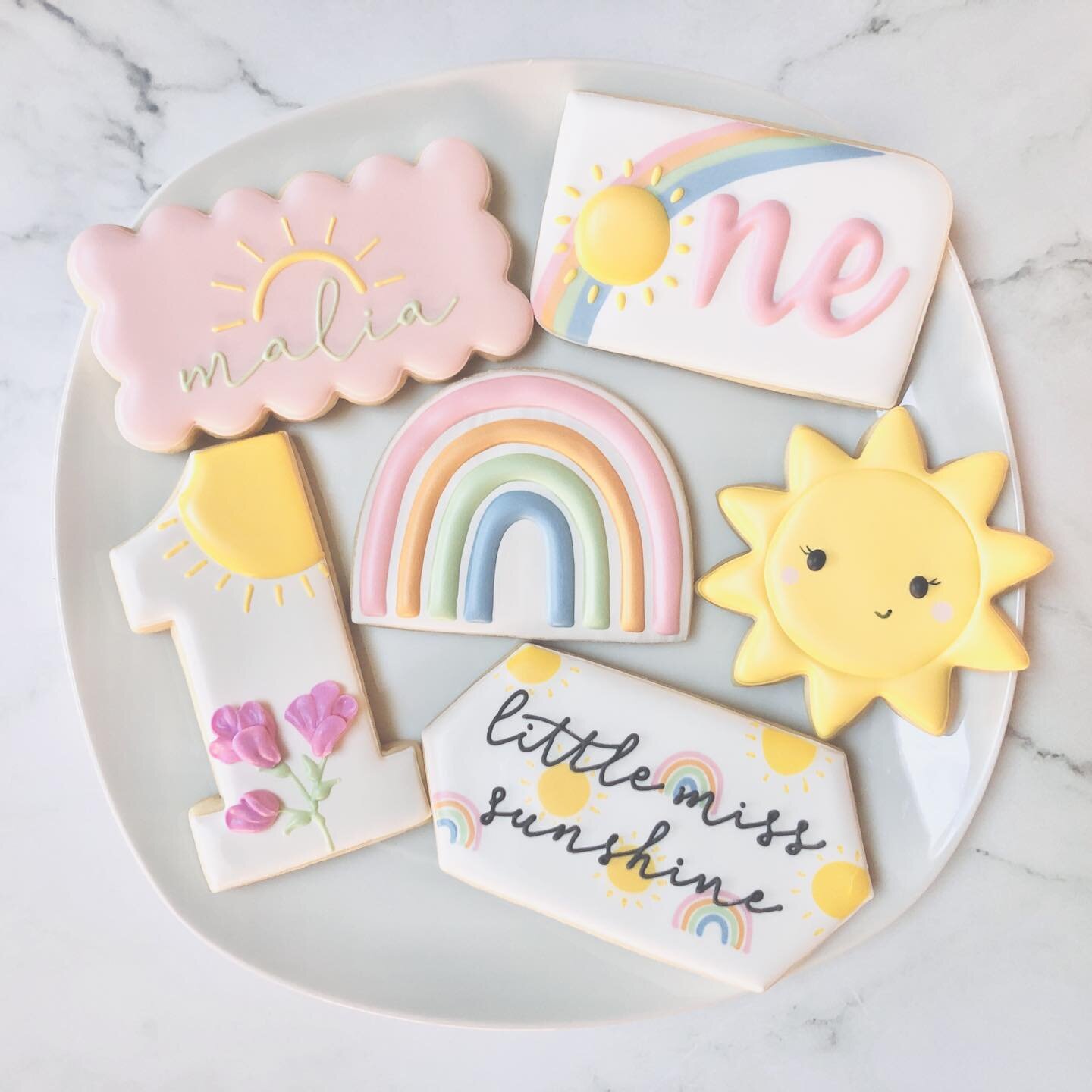 Cookies for a first birthday celebration! 🎉☀️🌈
.
.
.
.
. 
#thisisone #firstbirthday #happybirthday #happybirthdaycookies #birthdaycookies #birthdaytreats #birthdaypartyfavors #partyfavors #momsofinstagram #cookiefavors #royalicing #royalicingcookie