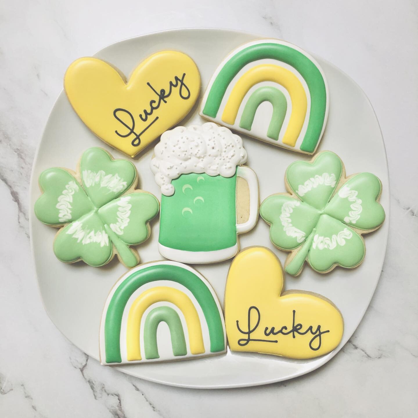 St. Patrick&rsquo;s Day cookies! 🍀🍺🌈💛💚
.
.
.
.
#stpatricksday #stpatricksdaycookies  #schoolcookies #teachersofinstagram #teacherappreciationcookies #teacherappreciation #royalicing #royalicingcookies #cookiefavors #decoratedsugarcookies #custom