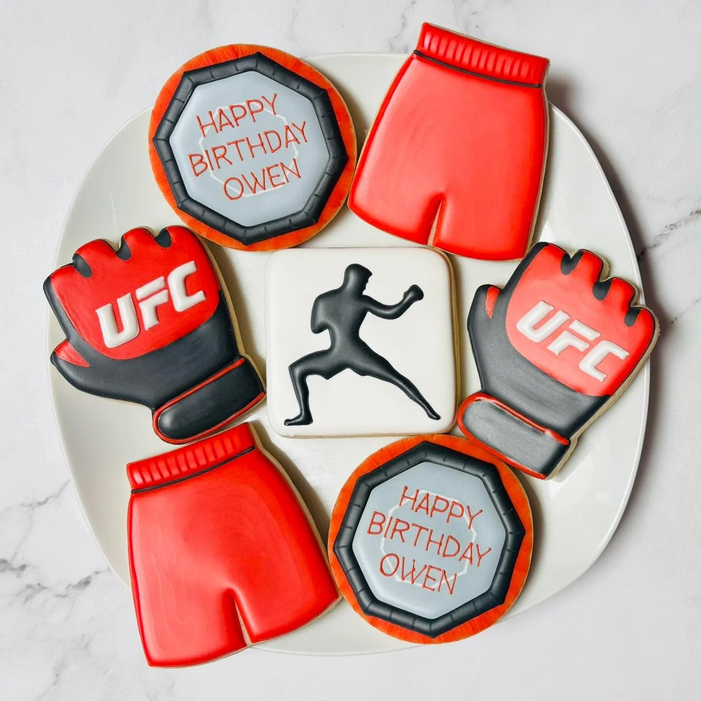 Cookies for a birthday celebration! 🎉
.
.
.
. 
#ufc #thisisthirteen #thisis13  #happybirthday #happybirthdaycookies #birthdaycookies #birthdaytreats #birthdaypartyfavors #partyfavors #momsofinstagram #cookiefavors #royalicing #royalicingcookies #dec