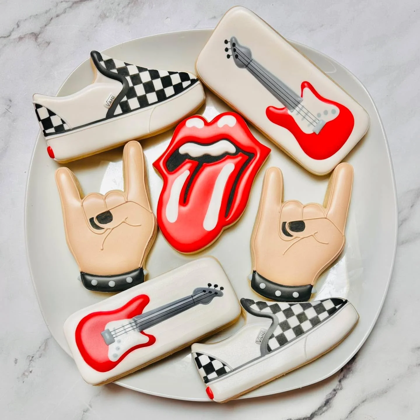 Cookies for a birthday celebration! ππΈπ€
.
.
.
. 
#rockon #rollingstones #electricguitars #vans #happybirthday #happybirthdaycookies #birthdaycookies #birthdaytreats #birthdaypartyfavors #partyfavors #momsofinstagram #cookiefavors #royalicing #roya